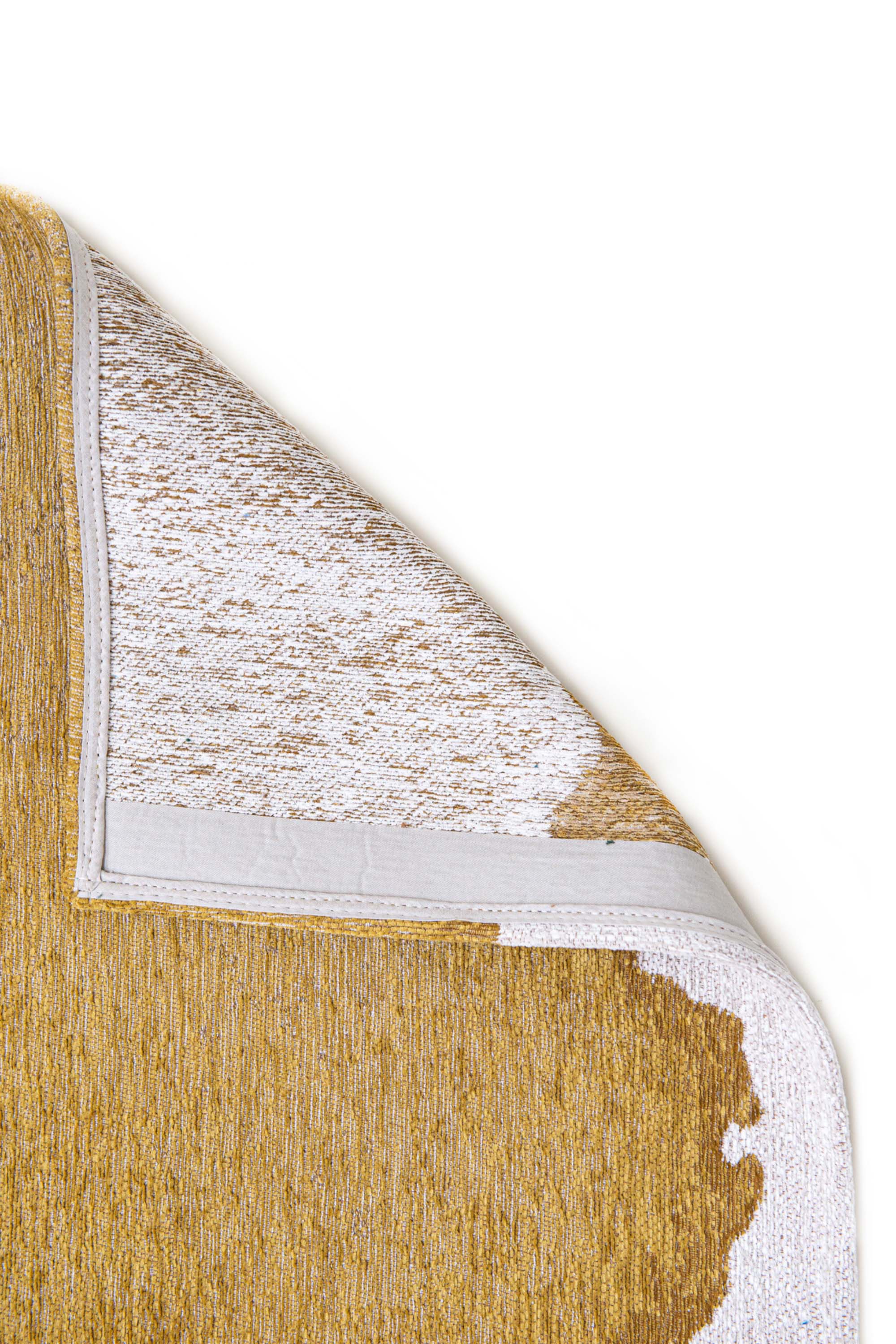 Modern rug with gold abstract shoreline pattern