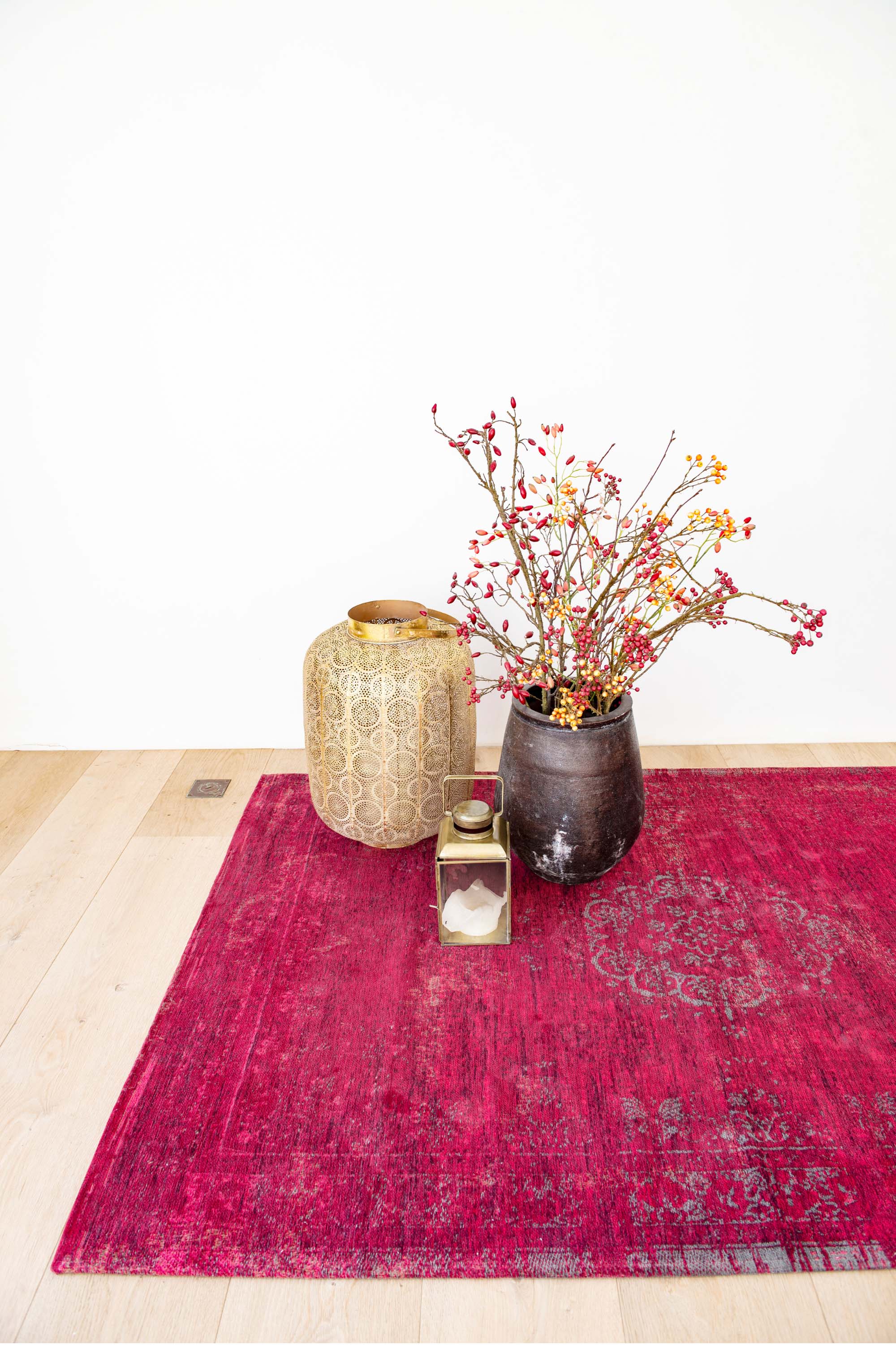 Red rug with faded persian design