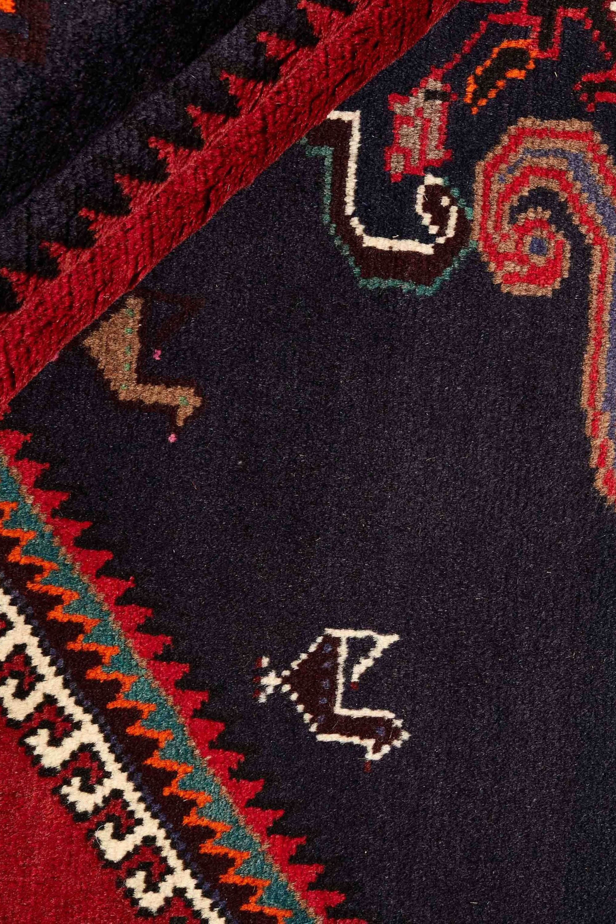 Authentic persian rug with a traditional geometric pattern in red