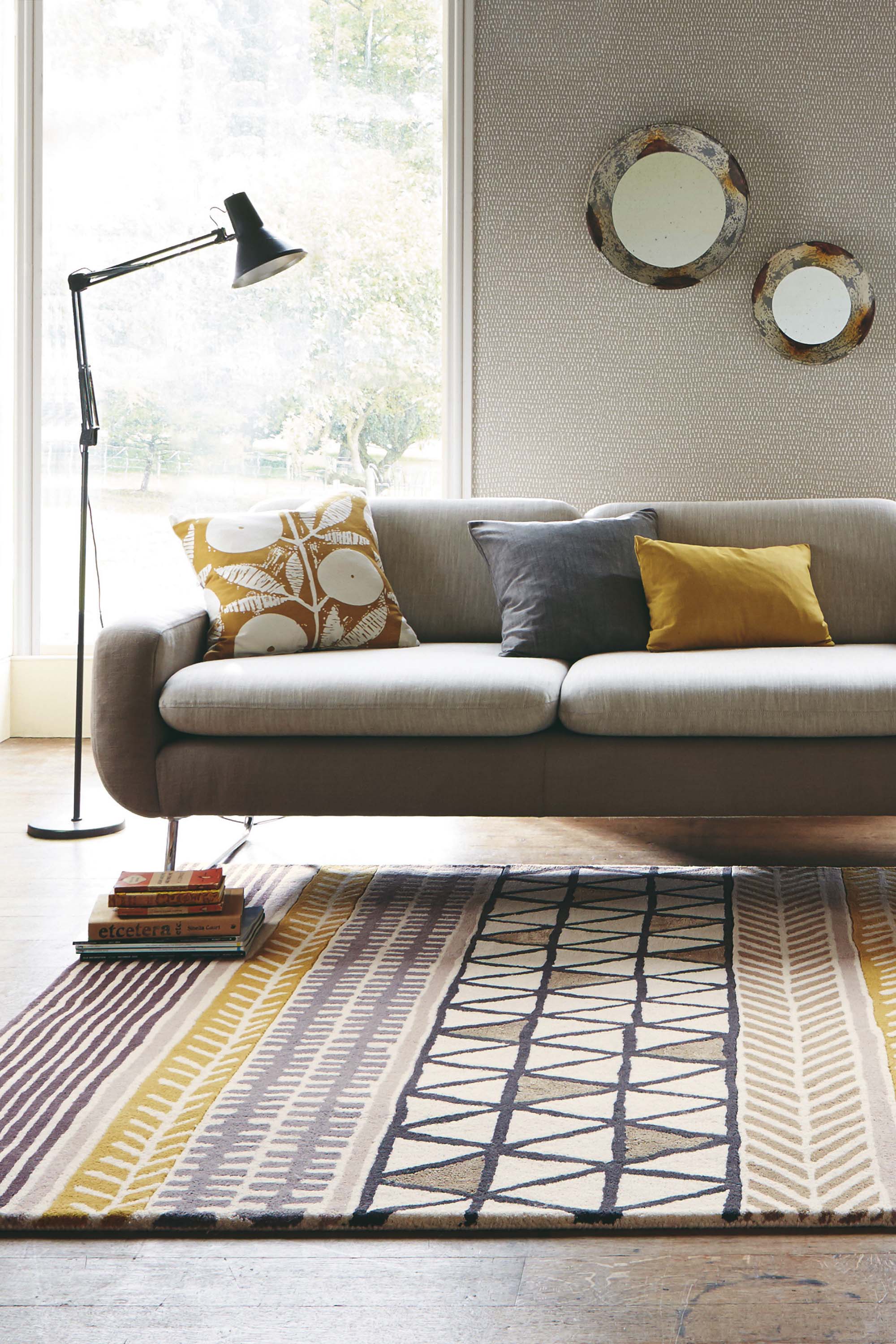 Quirky ethnic inspired pattern in yellow, taupe, cream and grey