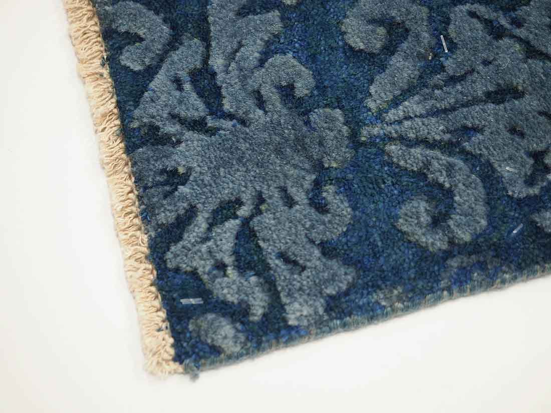 Authentic oriental rug with a damask pattern in beige