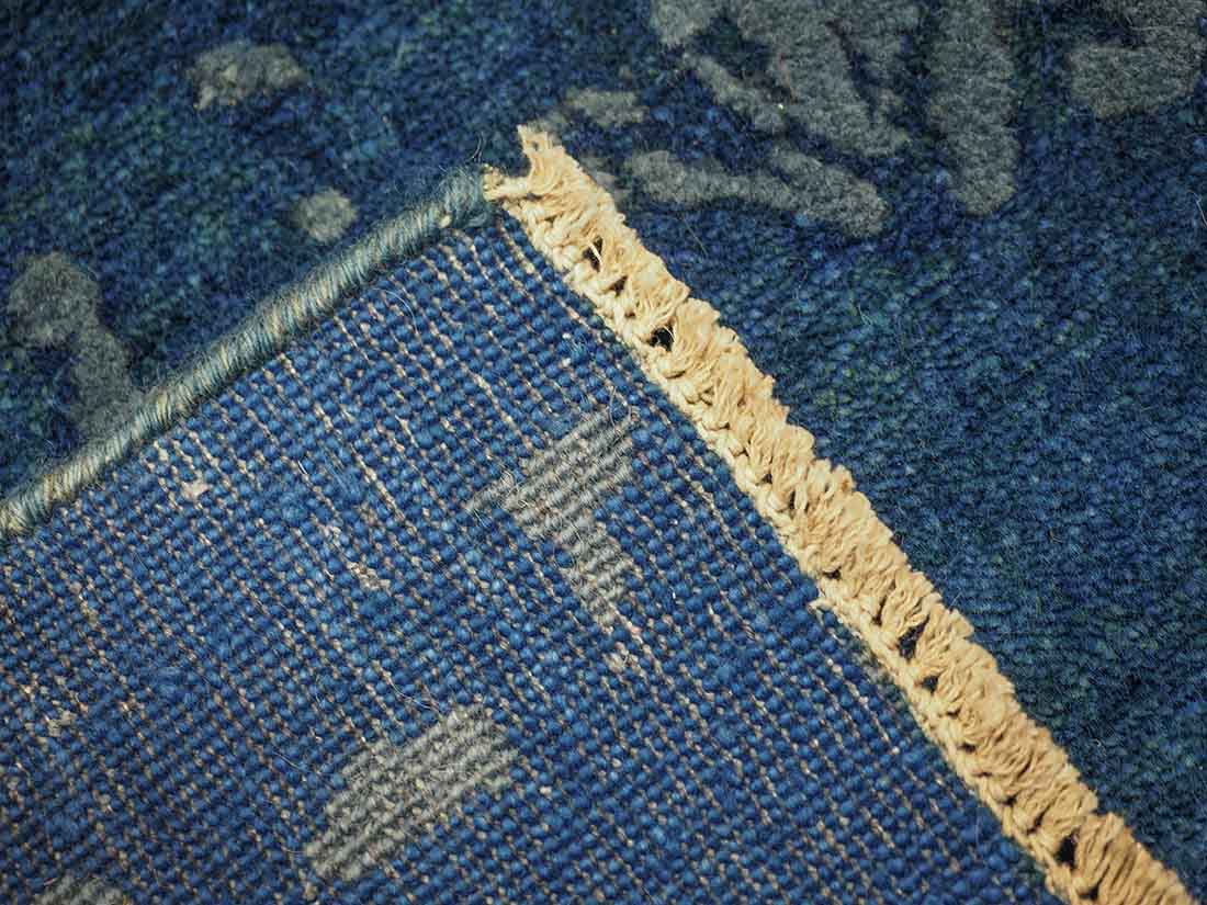 Authentic oriental rug with a damask pattern in beige