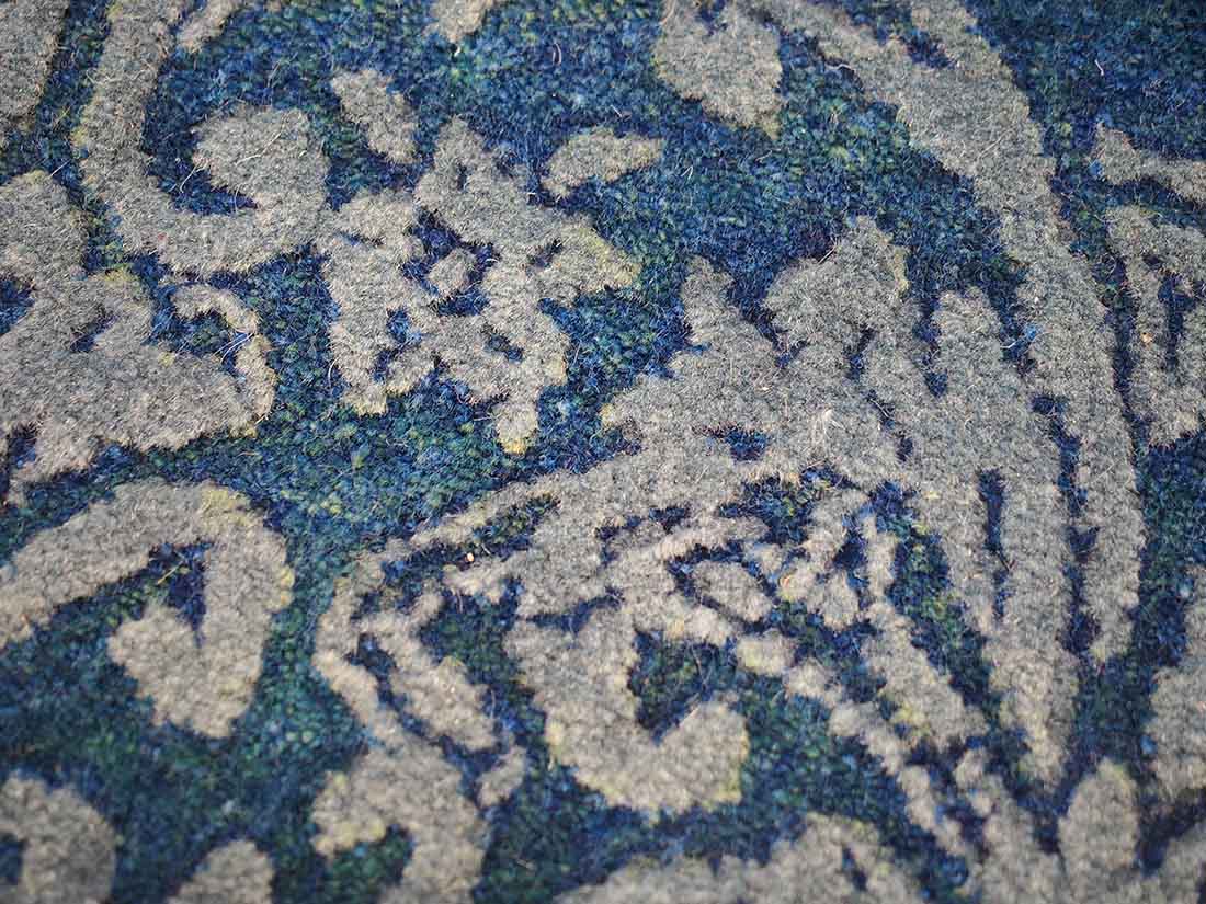 Authentic oriental rug with a damask pattern in beige