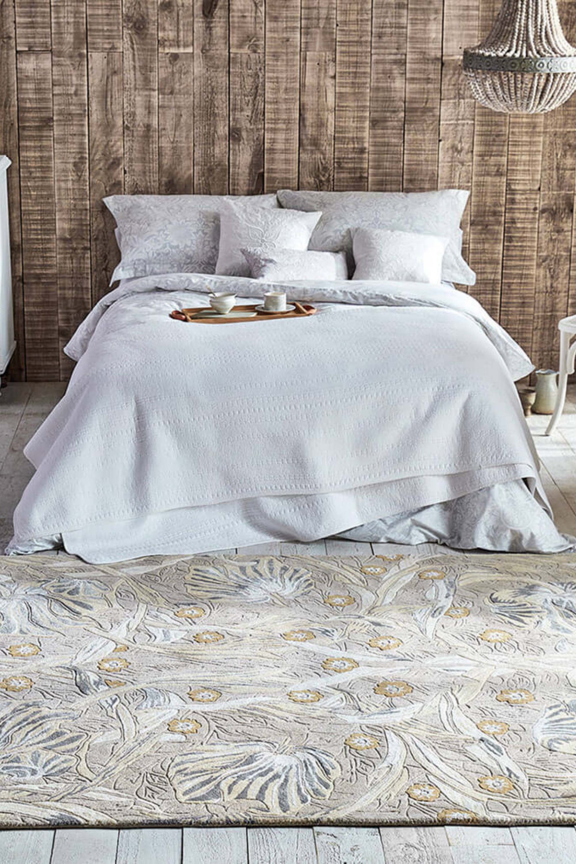 Wool rug with floral and foliage design in grey and beige