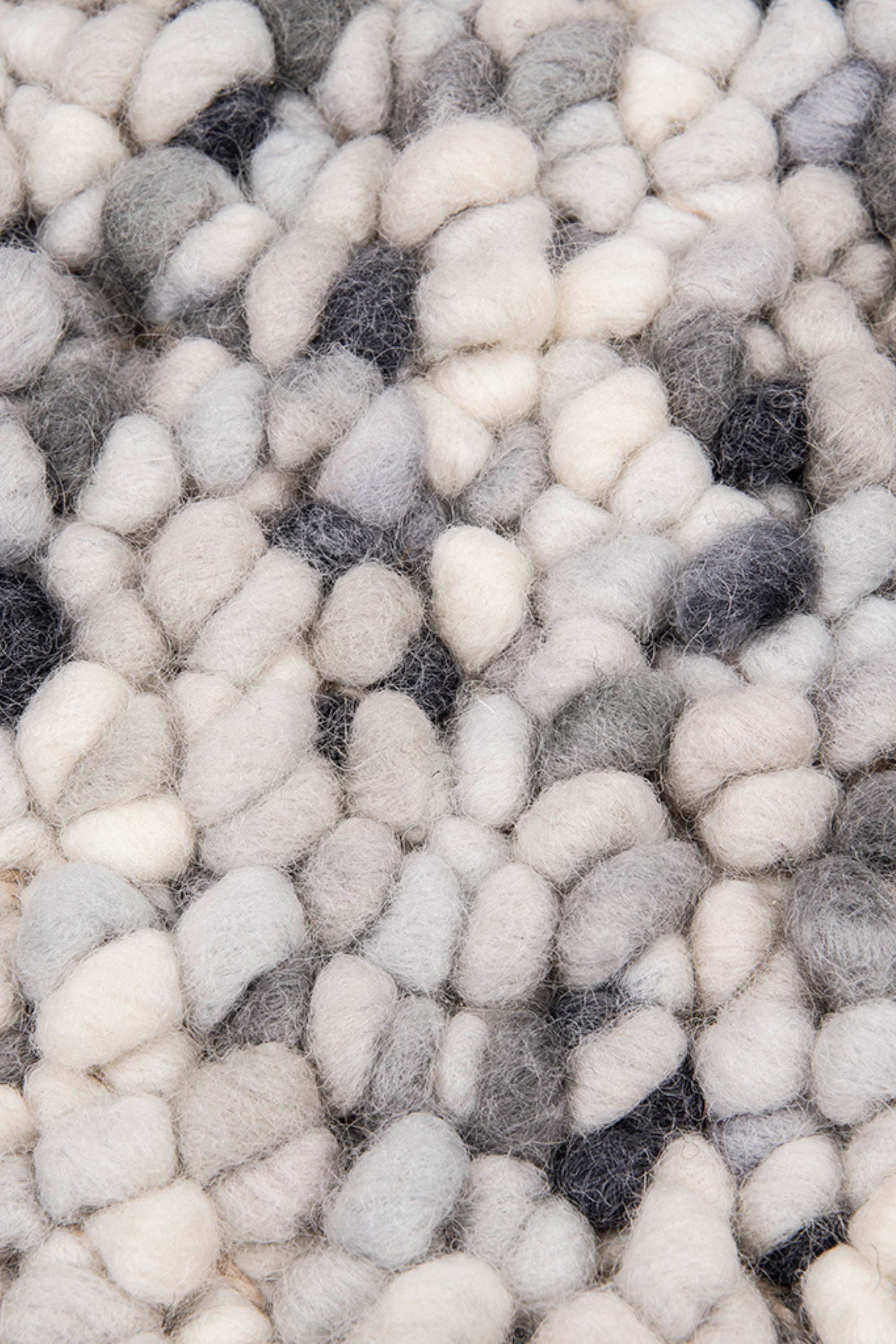 cream and grey textured area rug