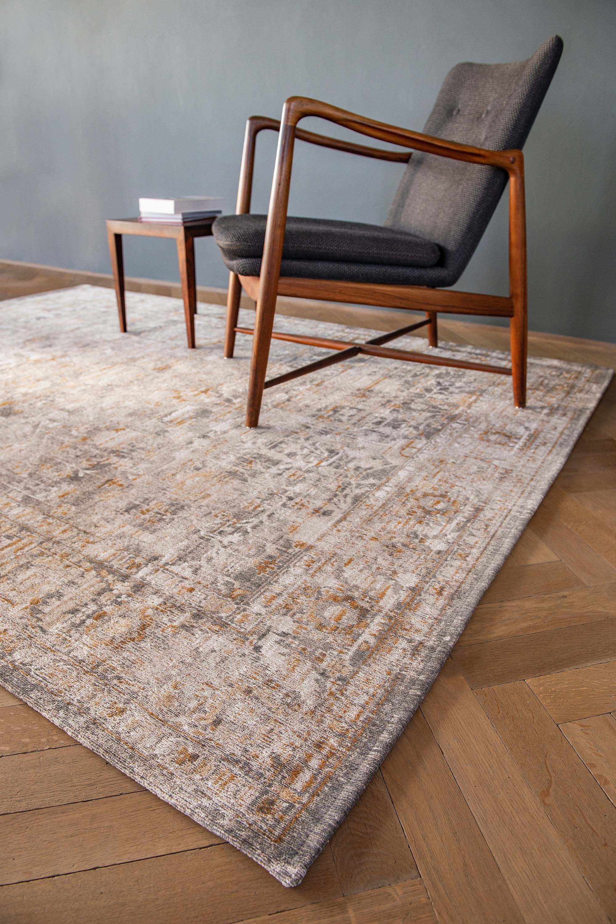 Distressed beige rug with turkish floral medallions and border in gold and grey
