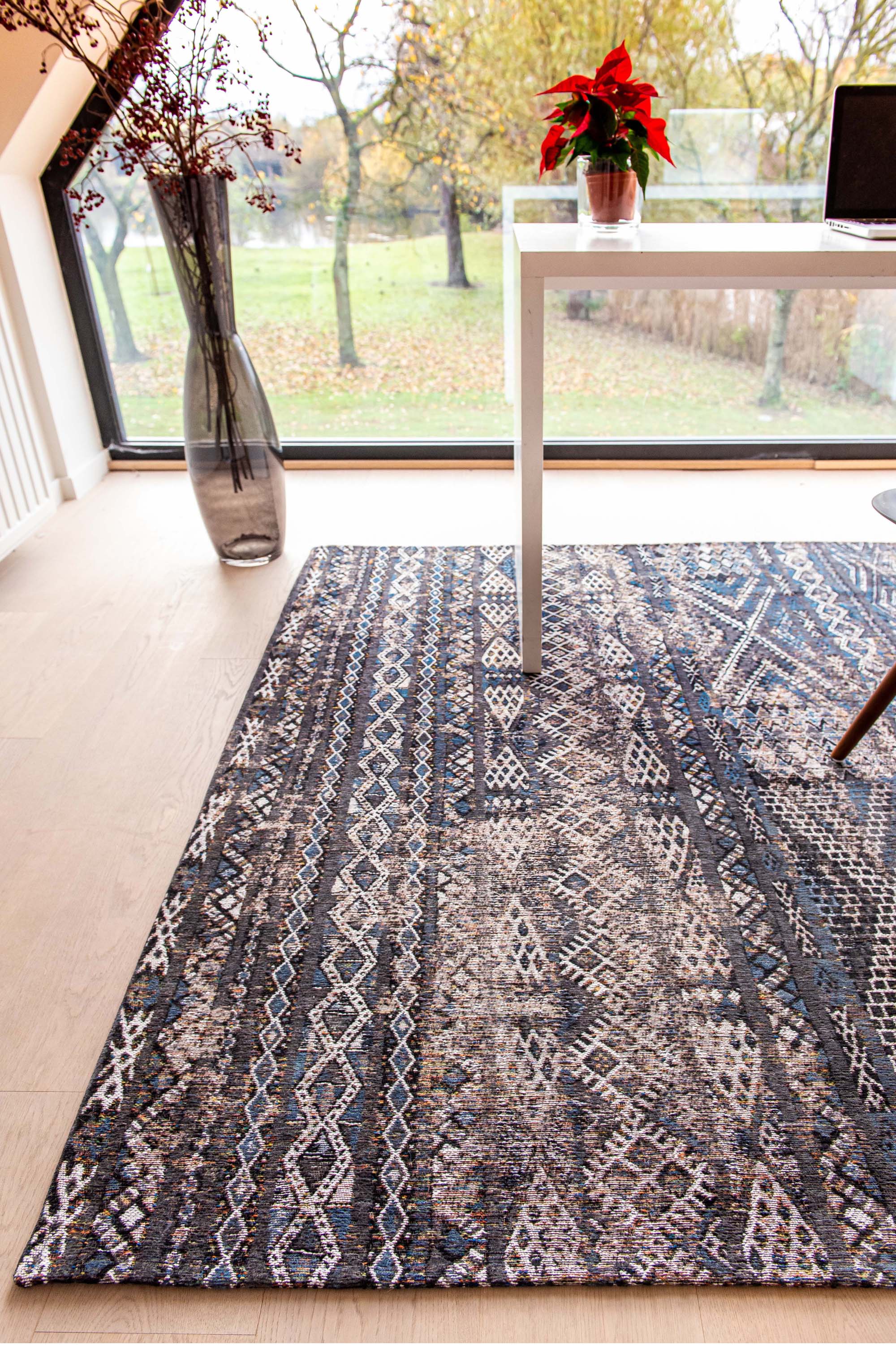 brown rug with a moroccan geometric pattern
