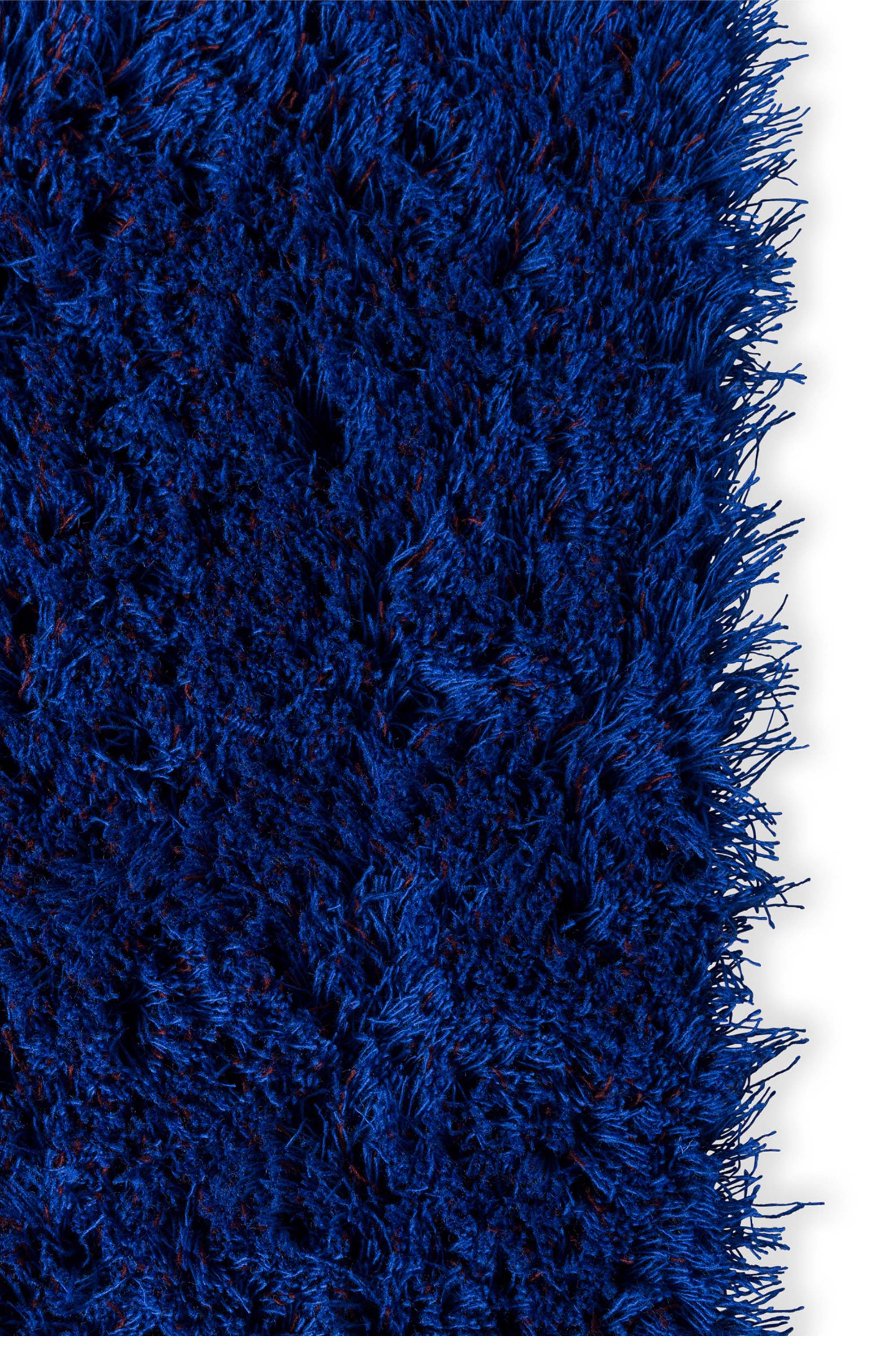 Plain blue rug with shaggy pile