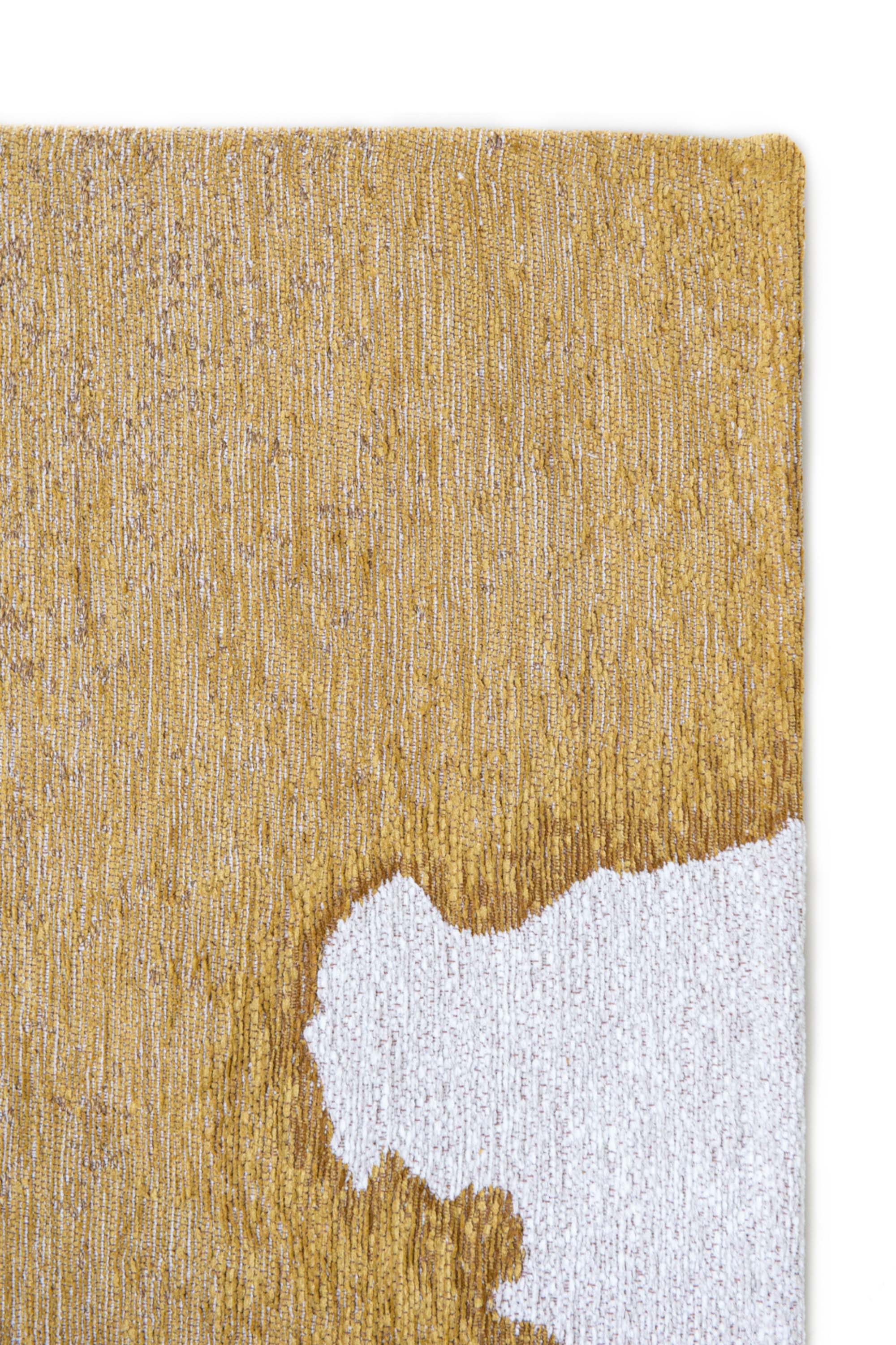 Modern rug with gold abstract shoreline pattern