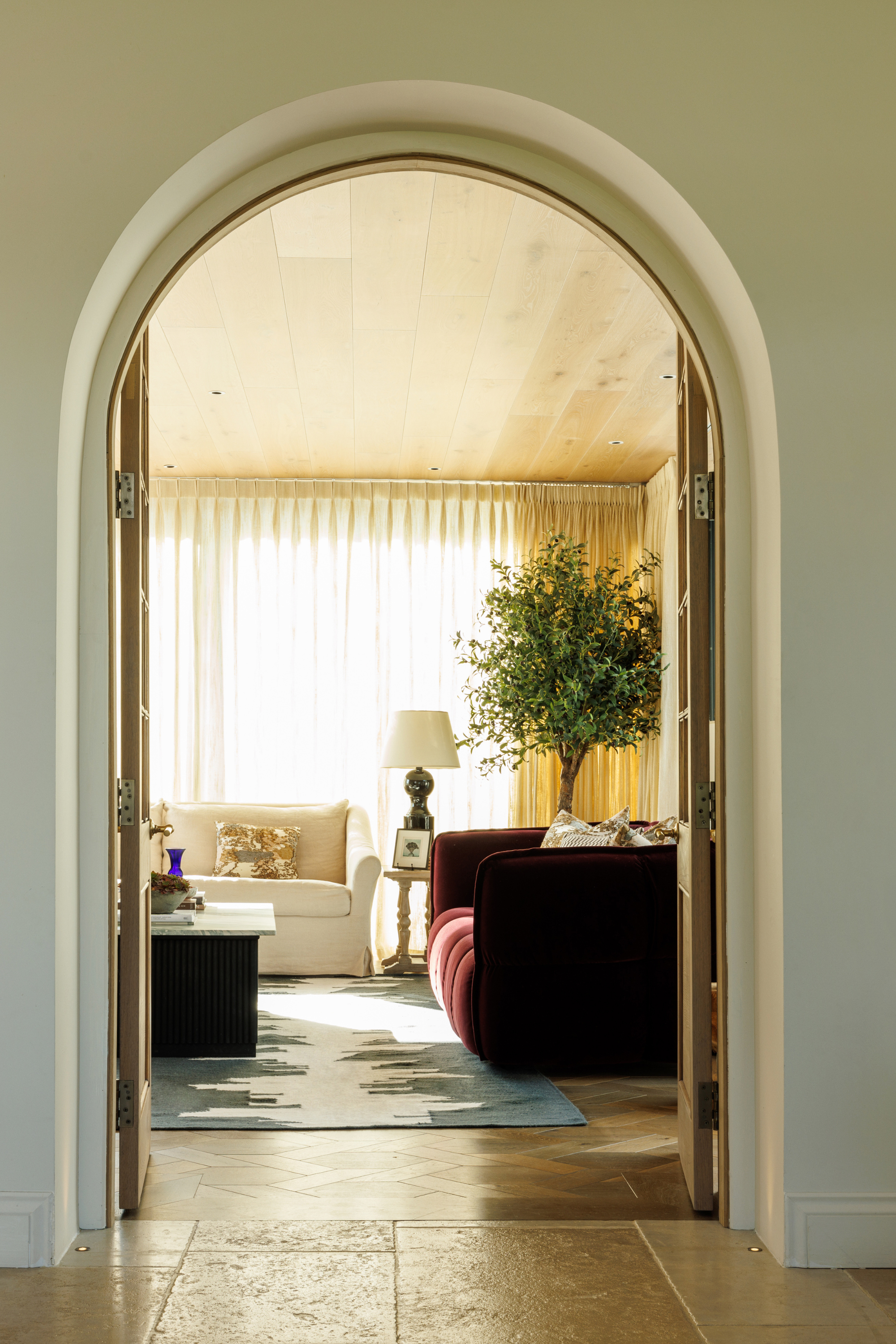 a black and white wool and cotton rug featuring a monochromatic modern abstract design placed in a living room