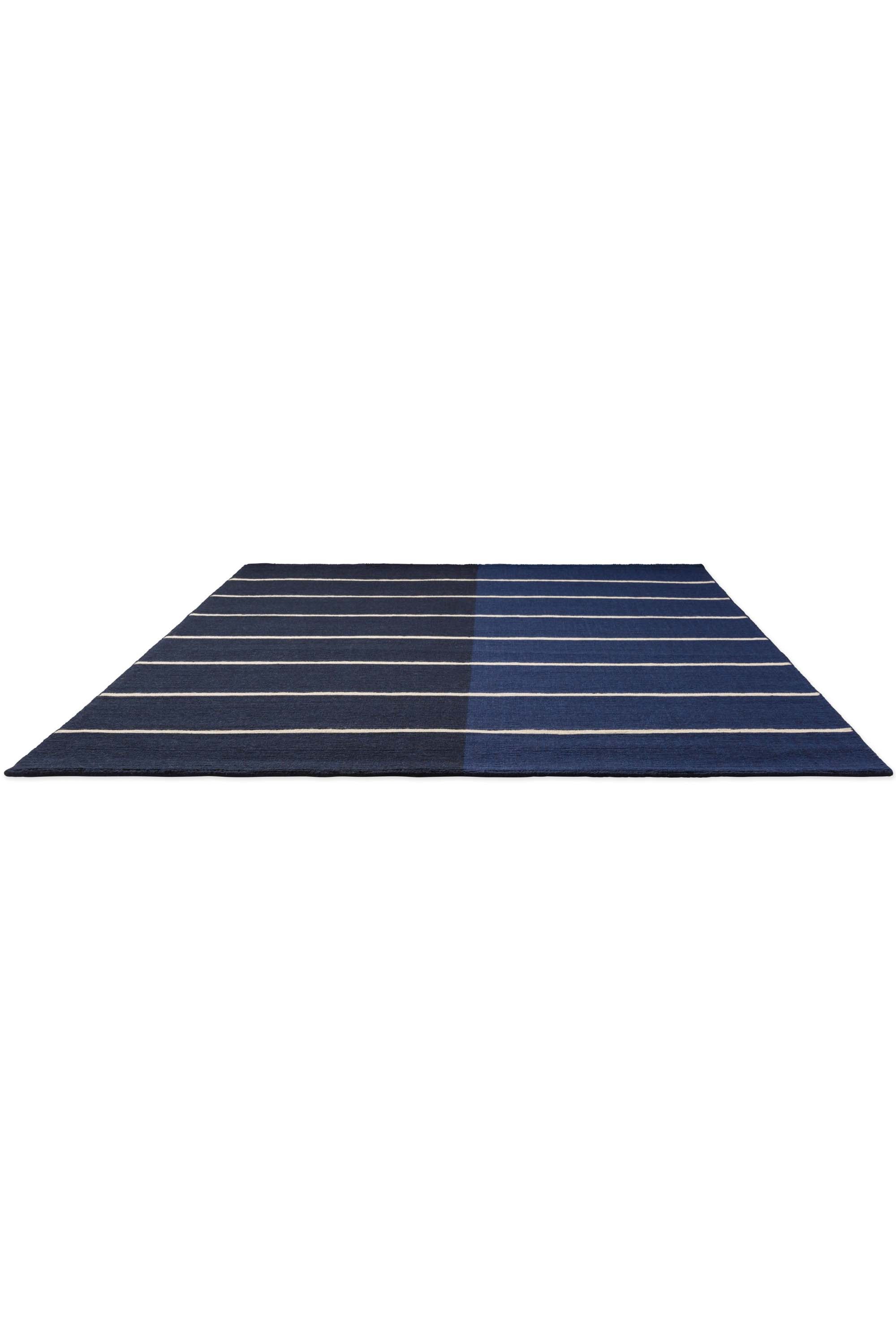 Geometric rug with blue linear pattern