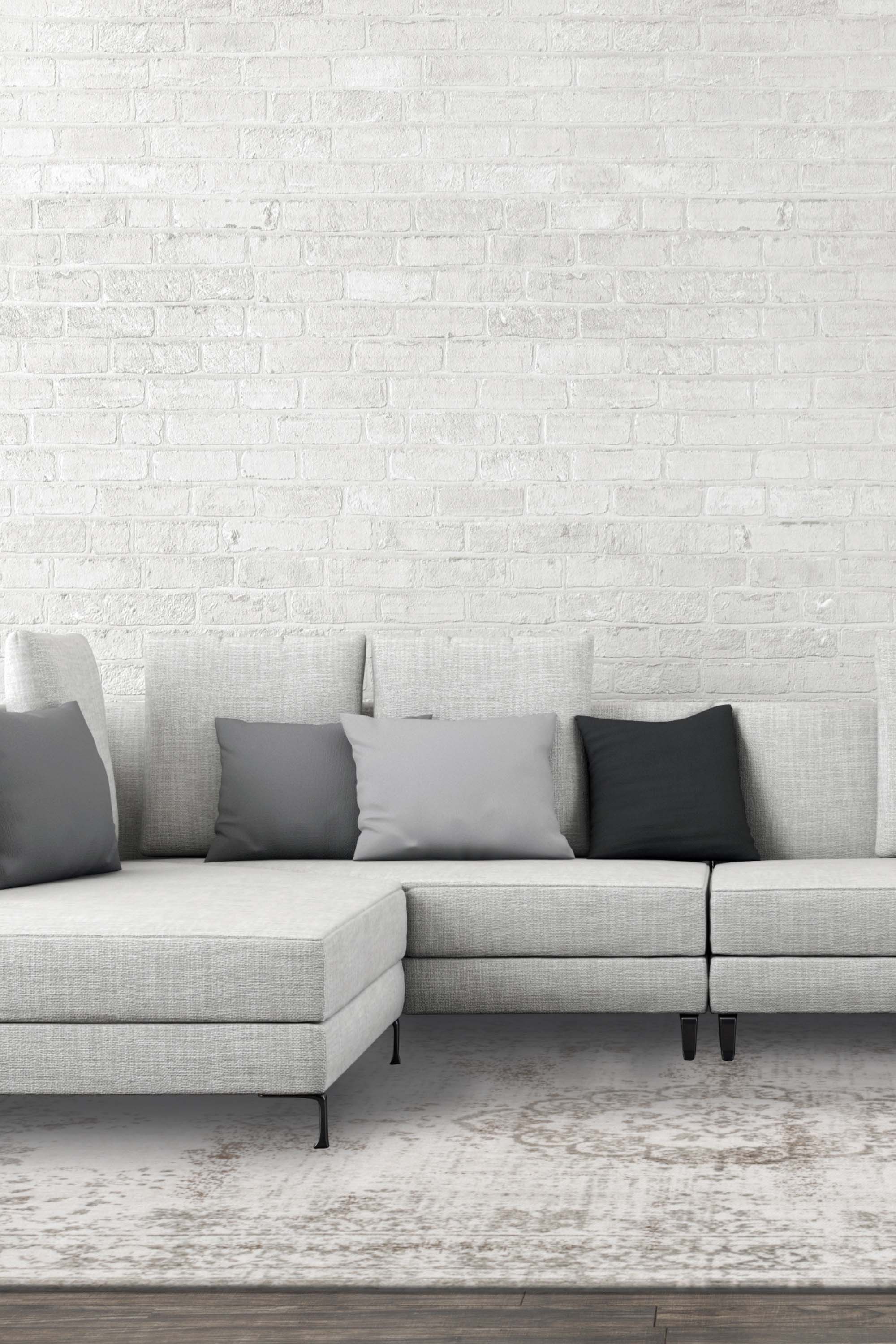 Grey rug with faded persian design