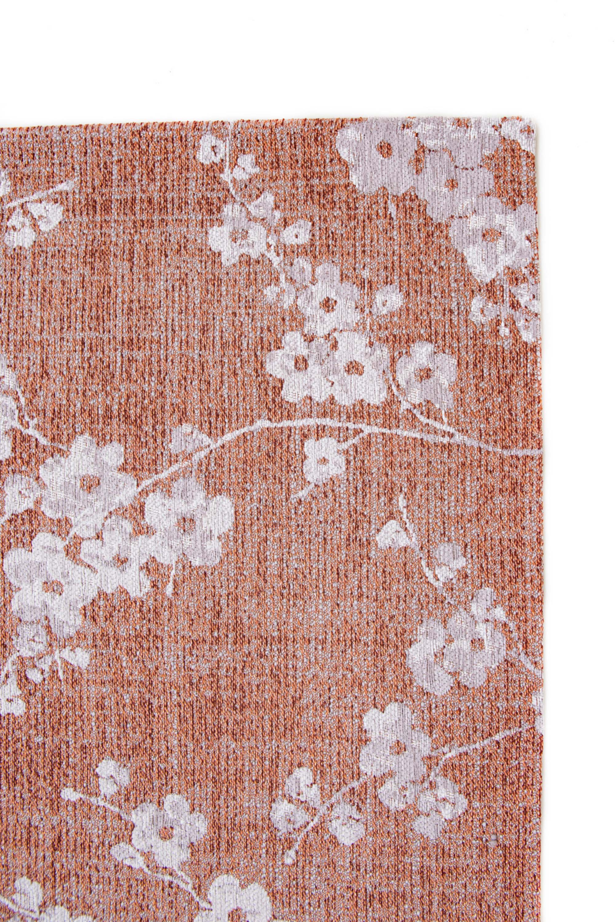 Modern abstract rug with subtle pink floral pattern