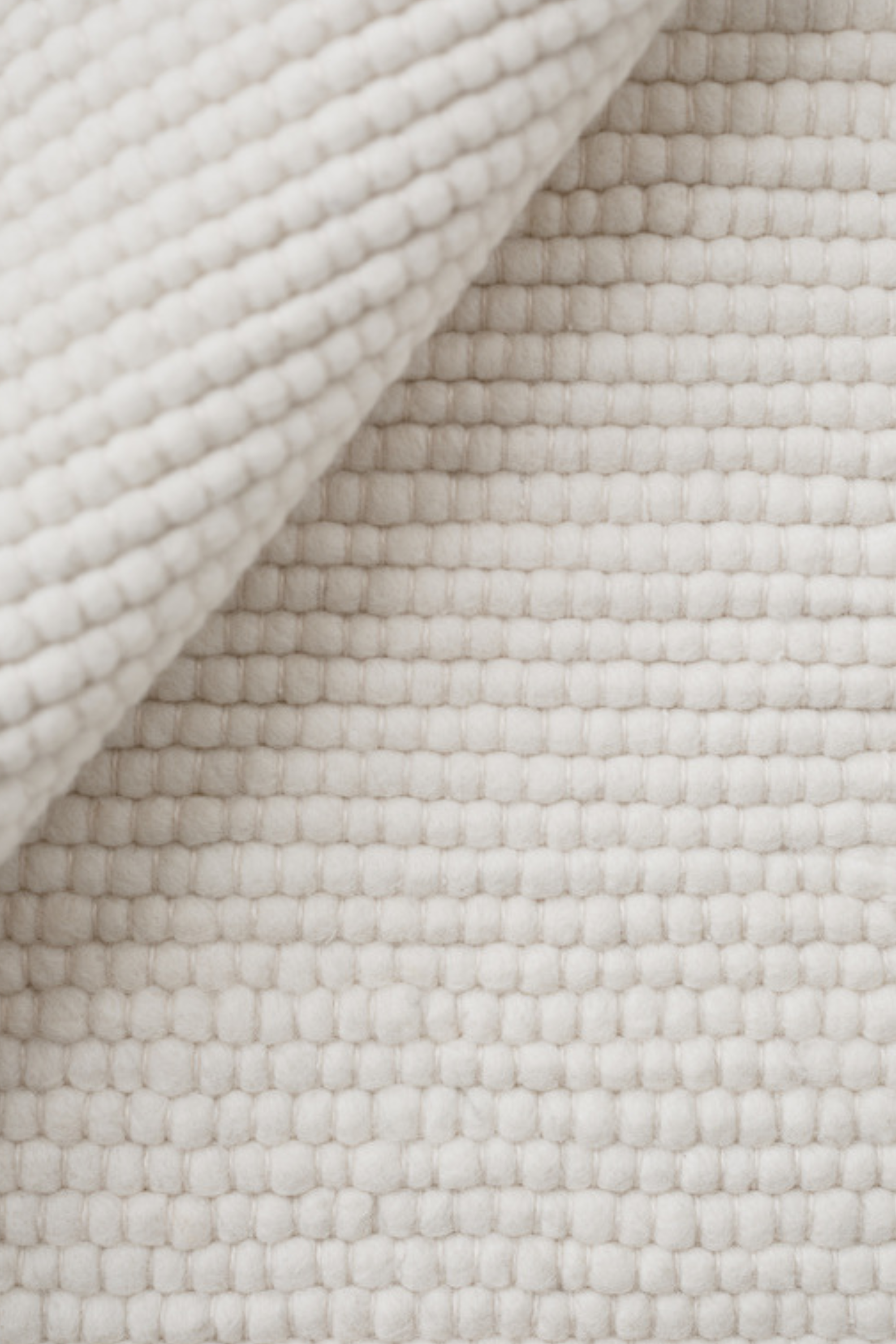 White textured woven rug
