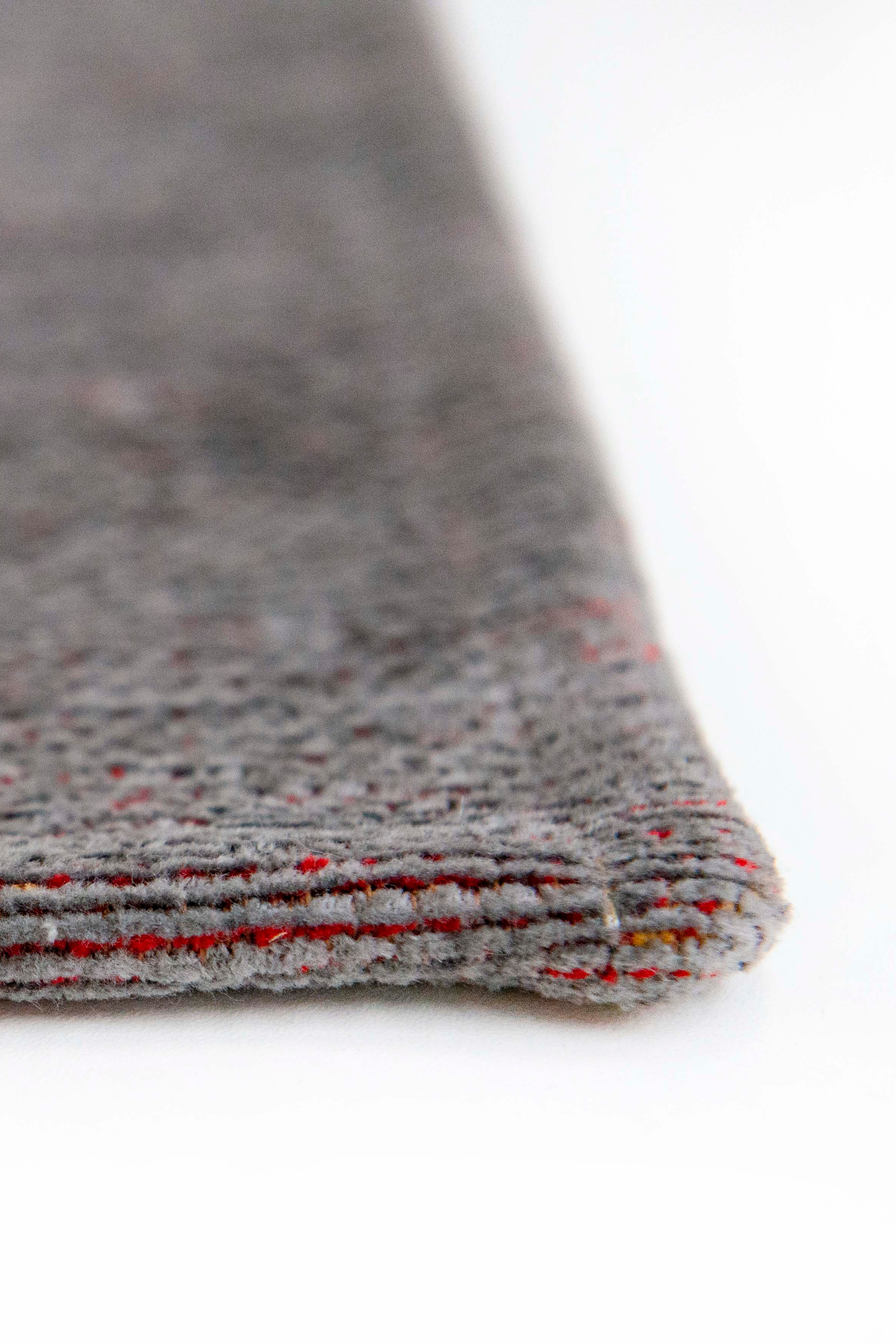 yellow, blue and red rug with an abstract face