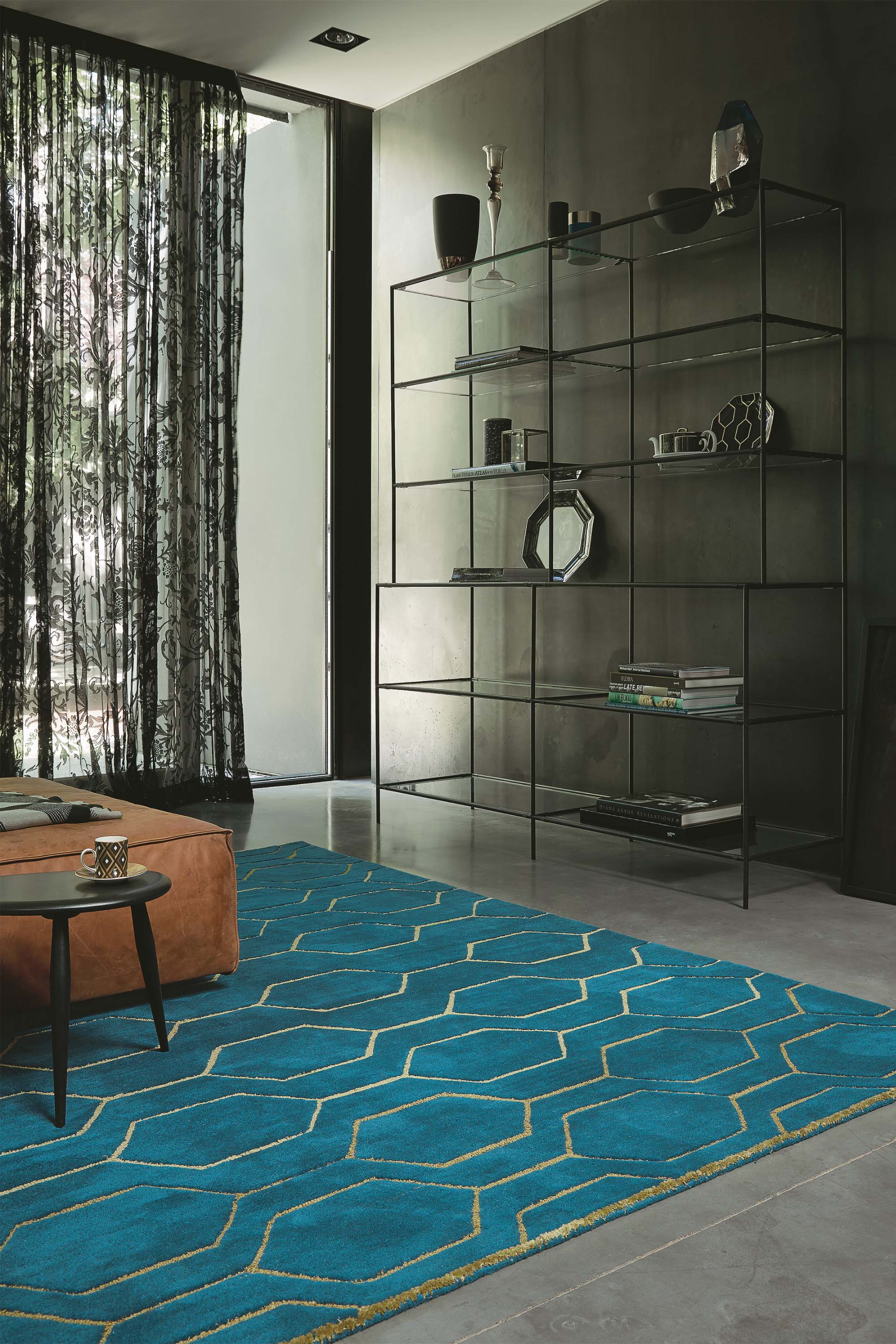 Rectangular teal green rug with repeat gold hexagon pattern