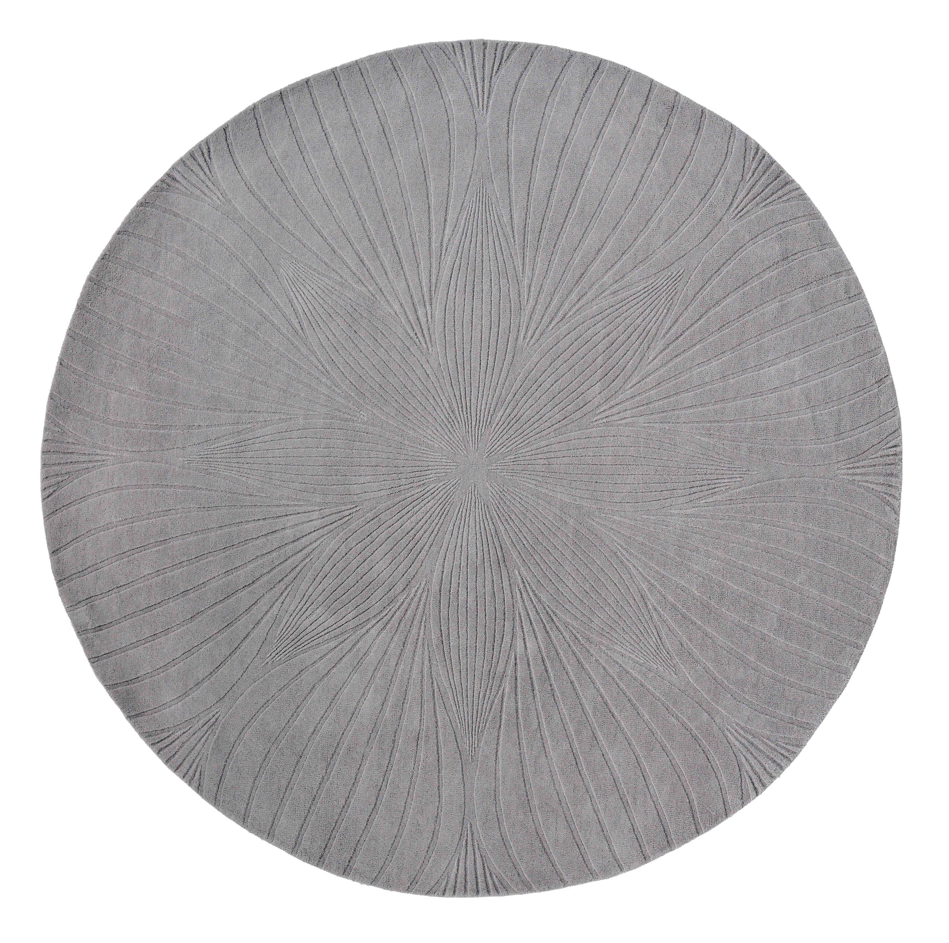 Round grey rug with engraved botanical pattern