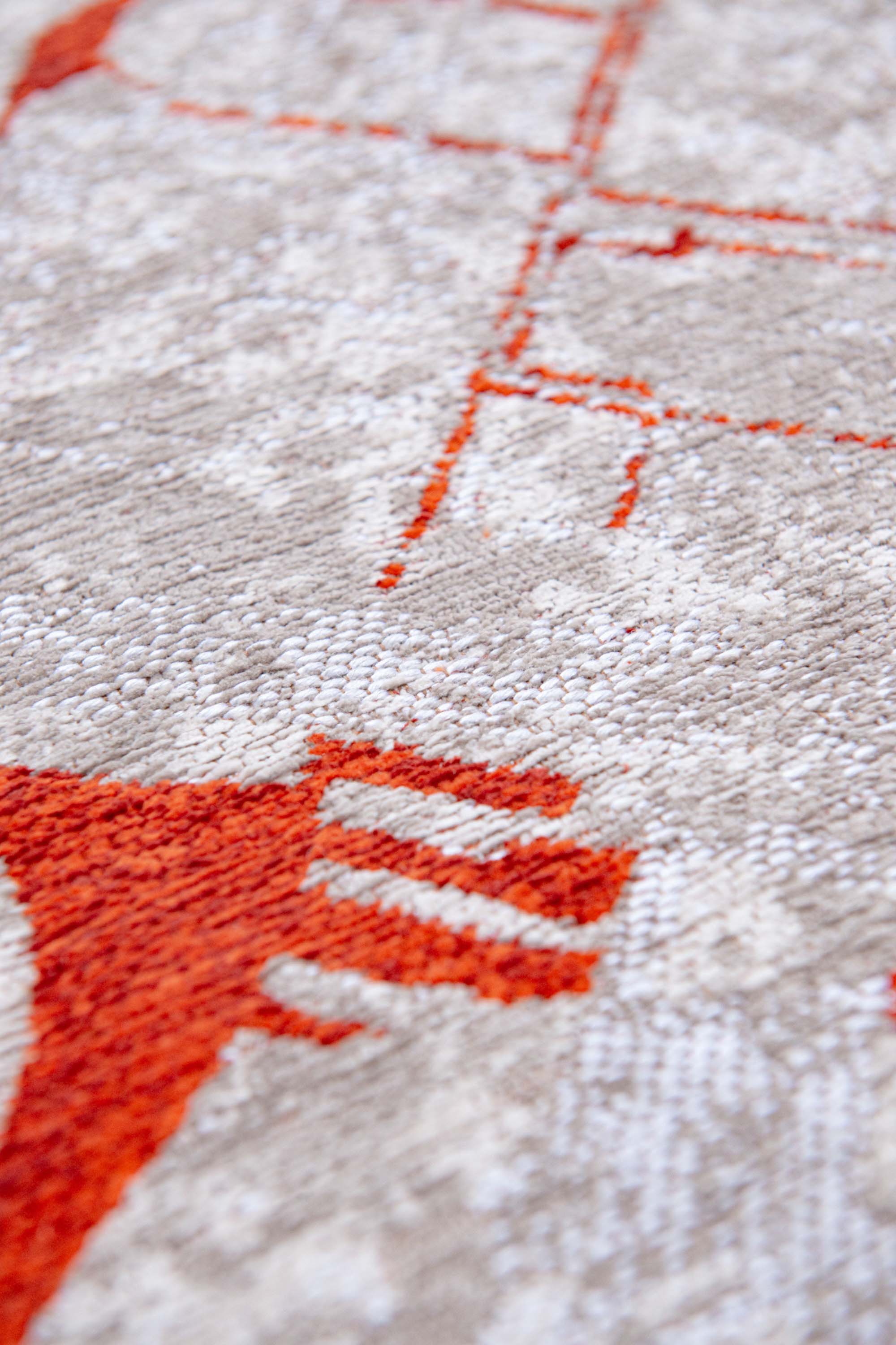Orange and grey abstract rug with a pattern inspired by the map of Amsterdamn