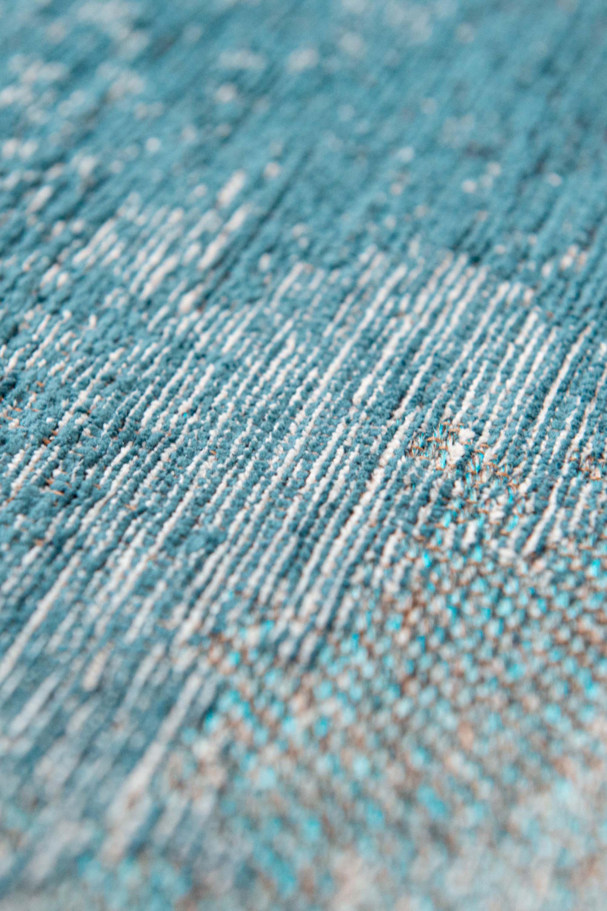 Modern circle rug with blue abstract shoreline pattern