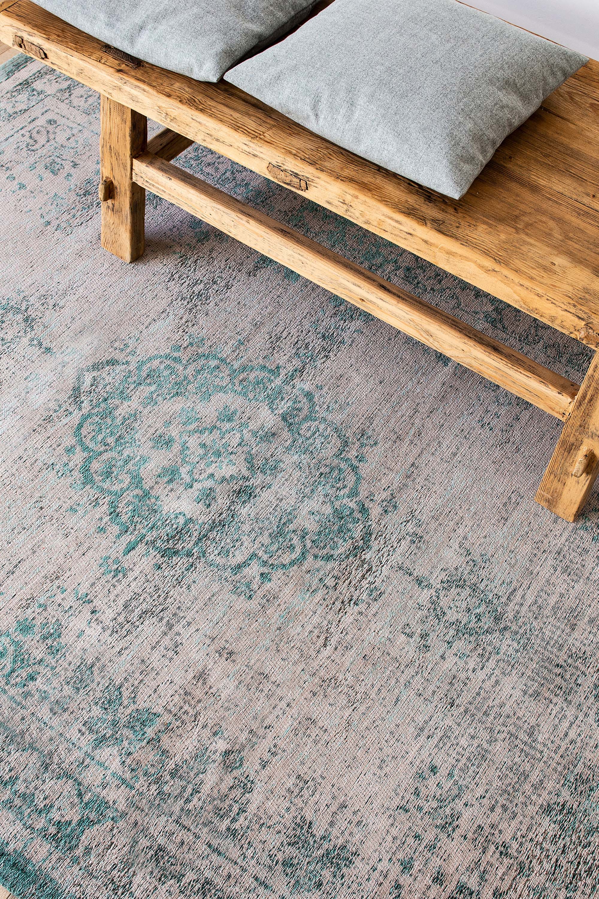 Grey flatweave rug with faded green persian design