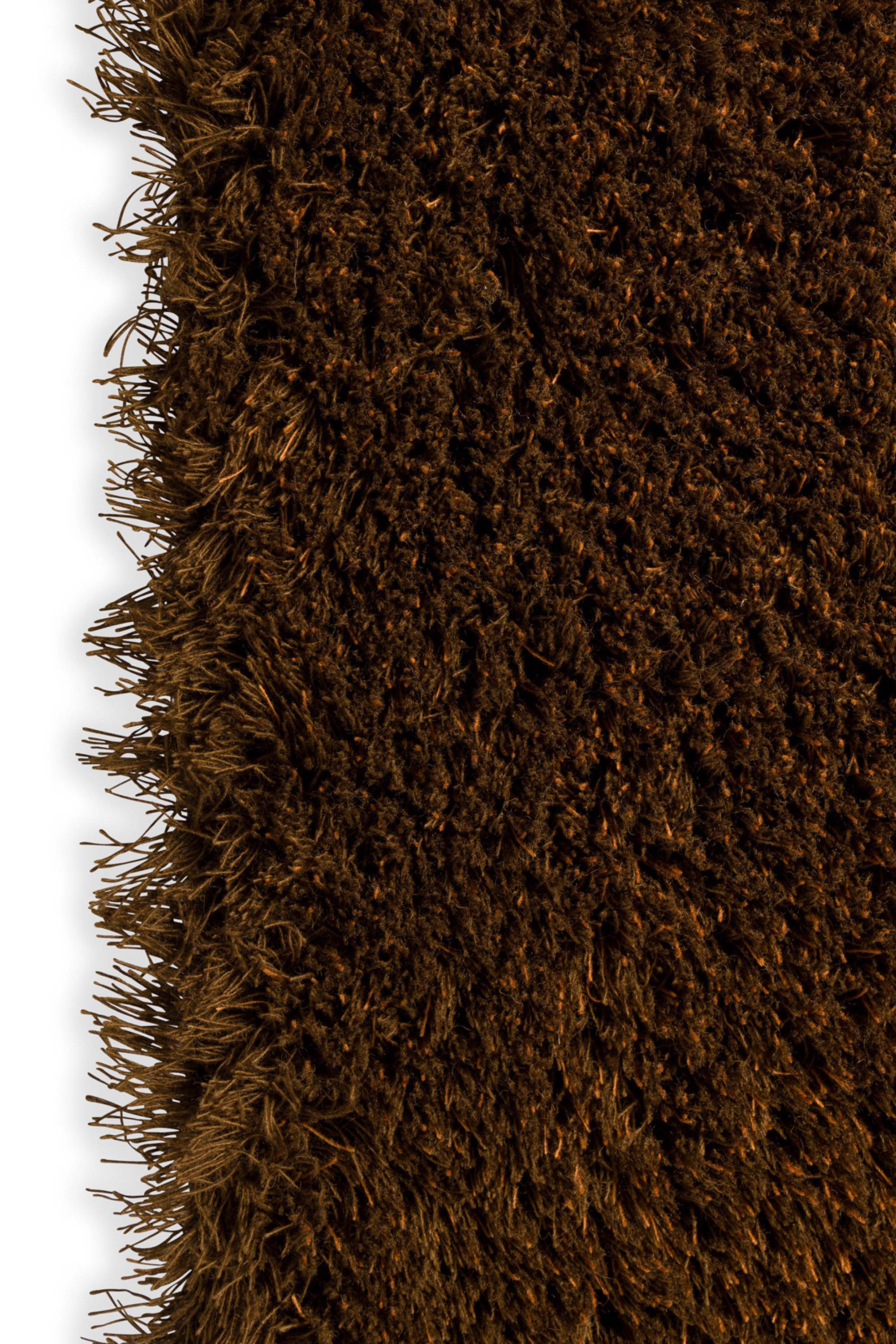 Plain orange rug with shaggy pile