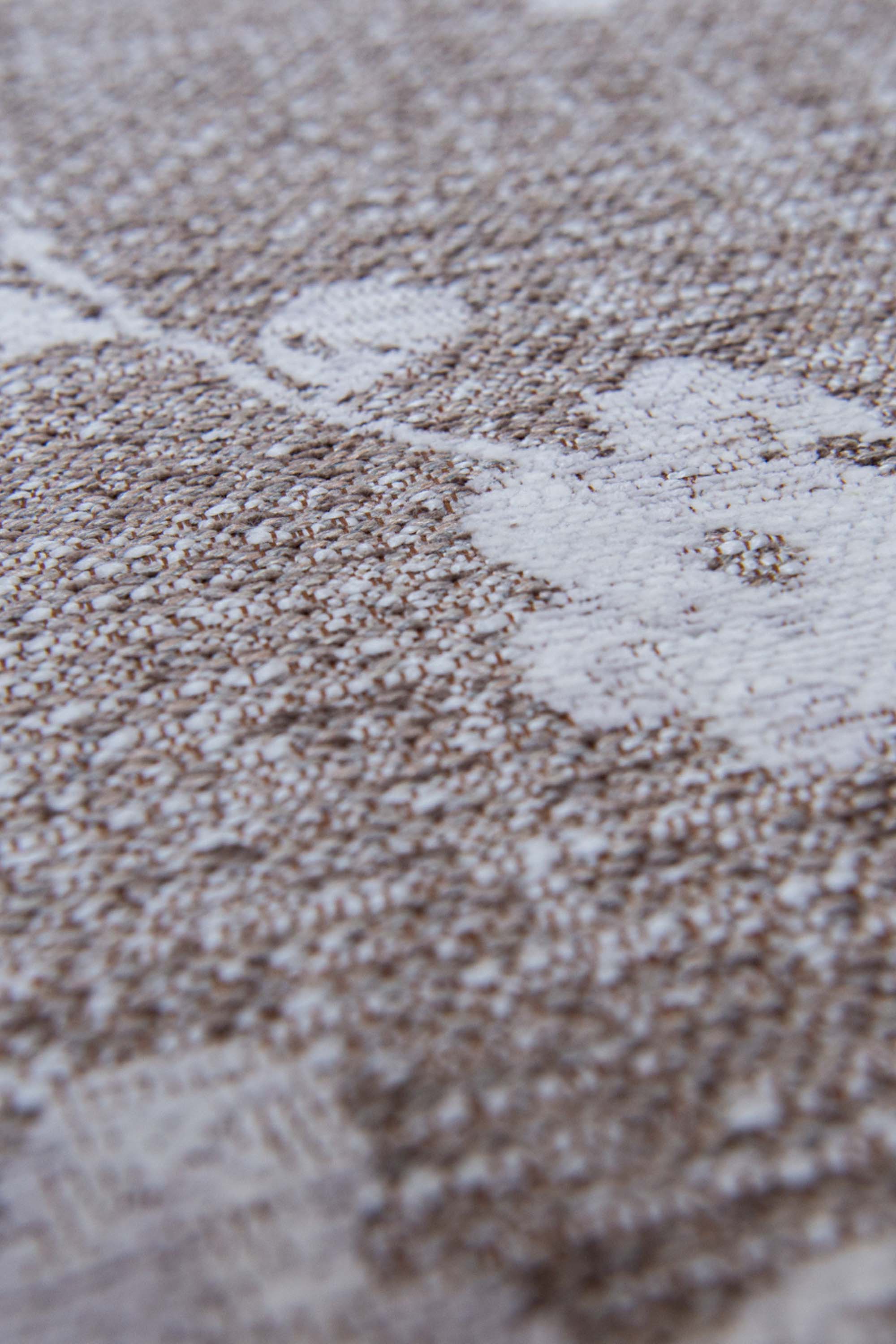 Modern abstract rug with subtle beige floral pattern