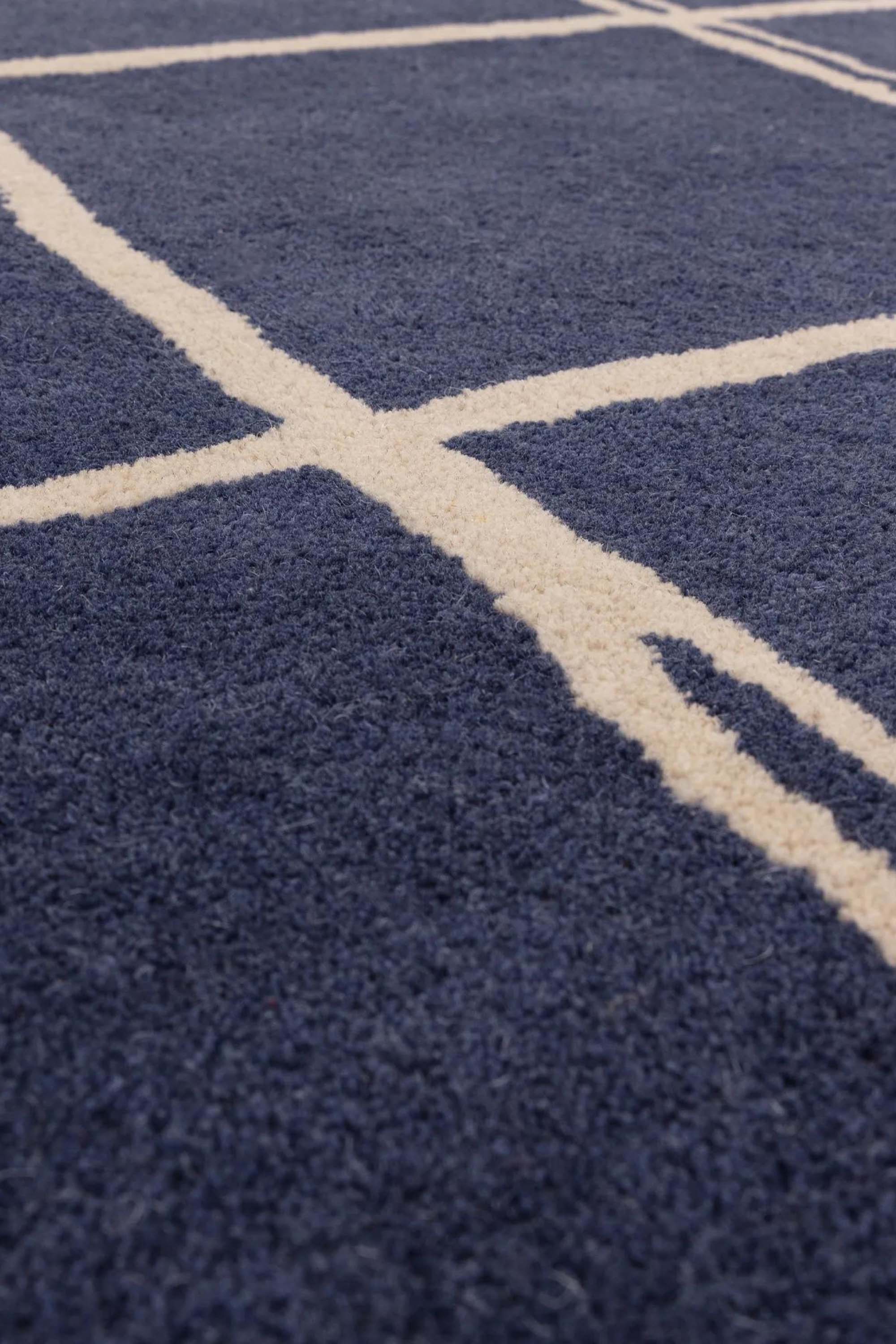 Blue rug with minimal geometric pattern