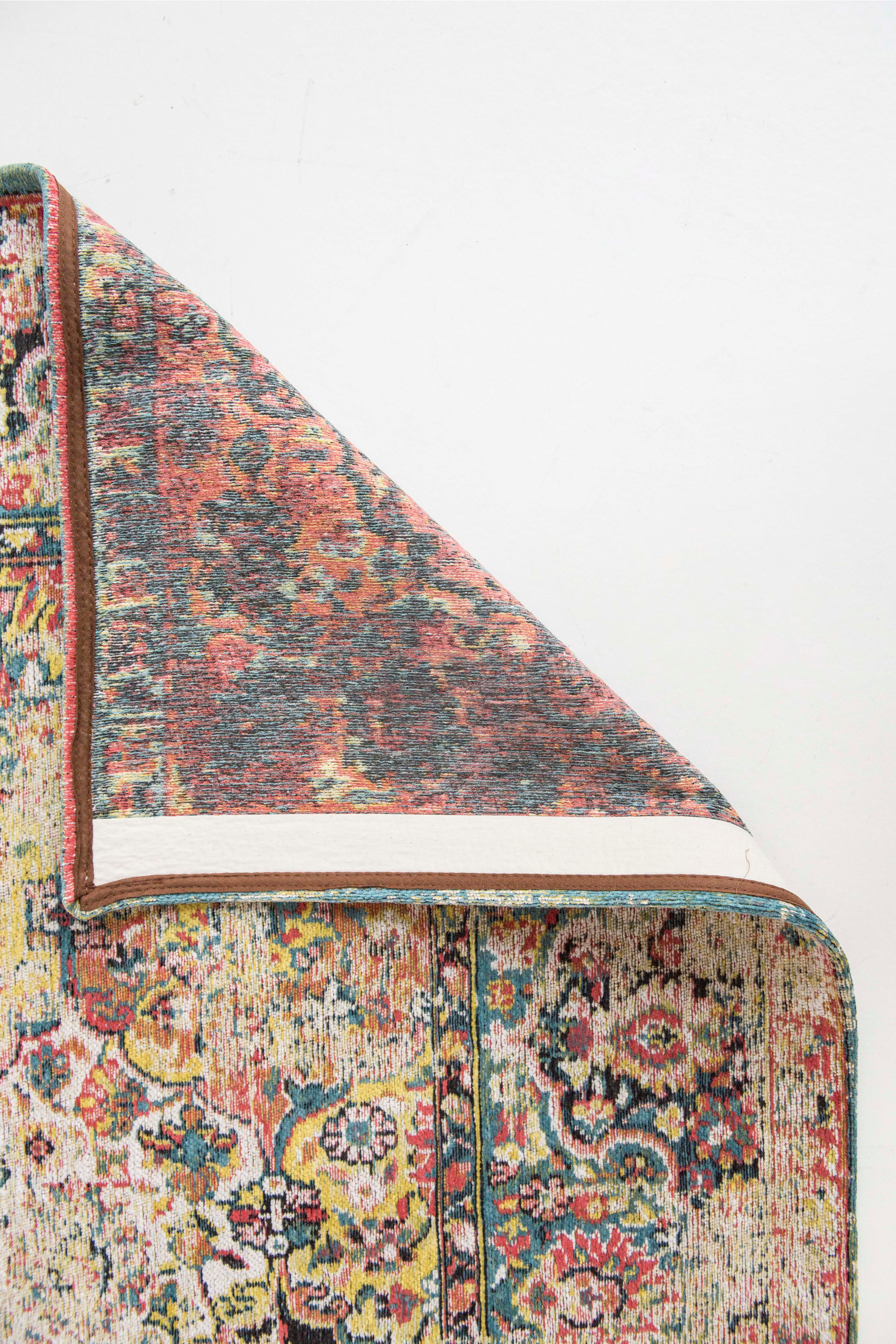 Flatweave rug with faded persian design in blue, red and yellow