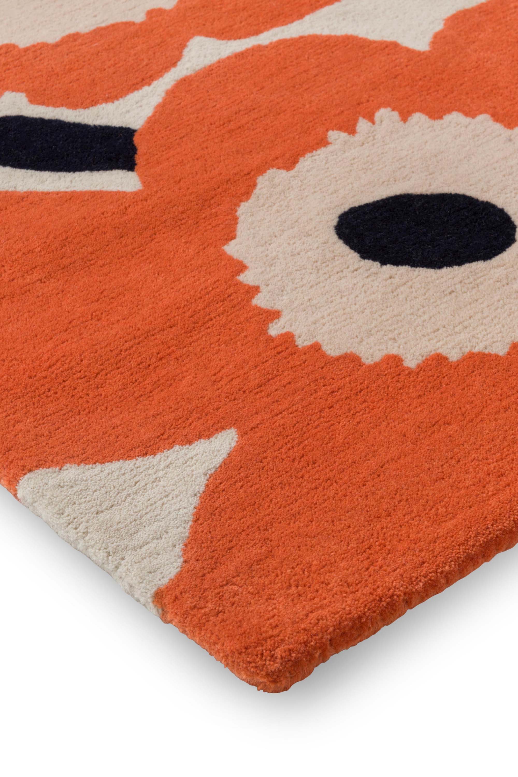 Orange patterned floral rug