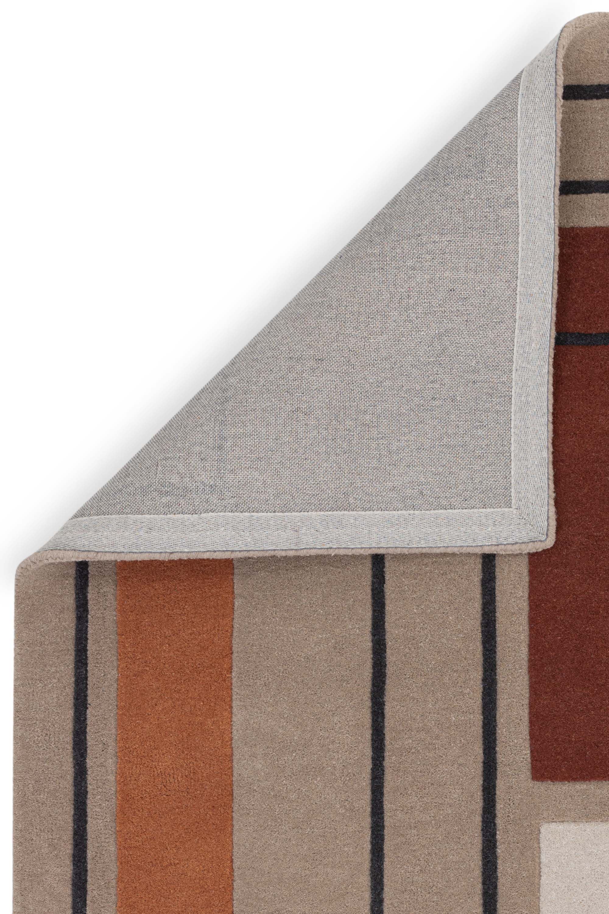 Geometric wool rug featuring a minimal pattern