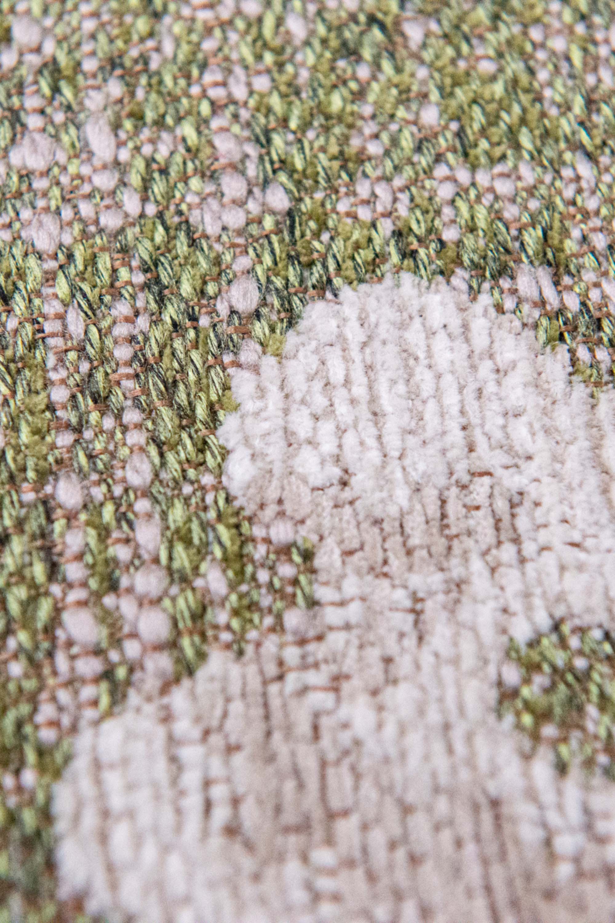 Modern abstract rug with subtle green floral pattern