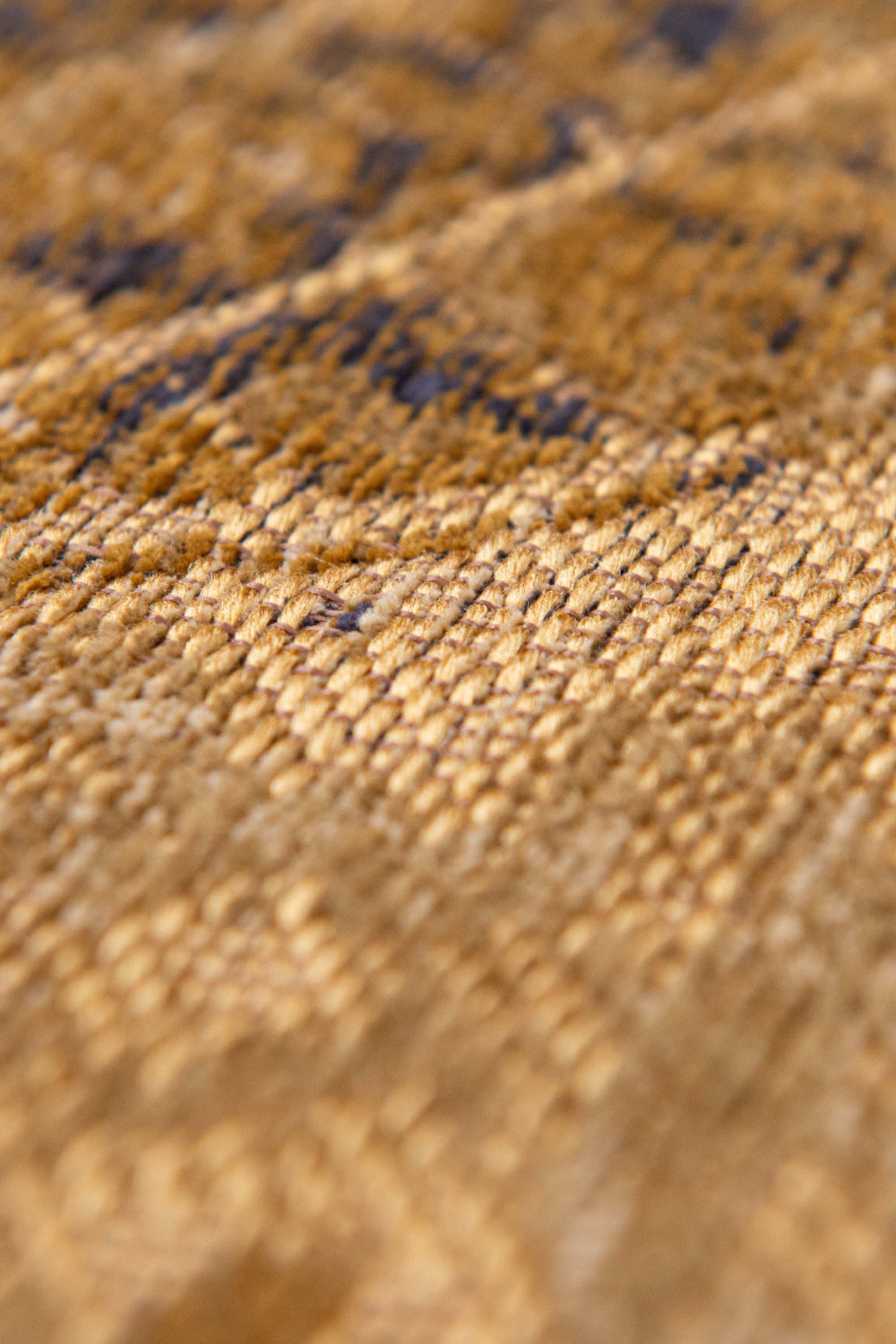 Gold abstract circle rug with a pattern inspired by the map of New York