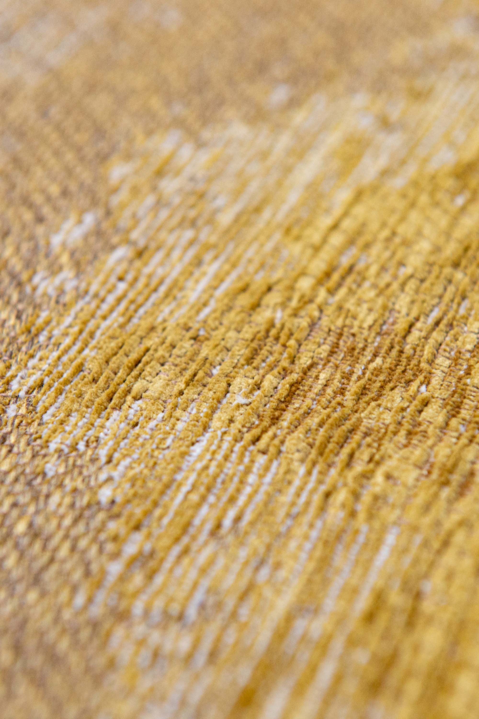 Modern circle rug with gold abstract shoreline pattern