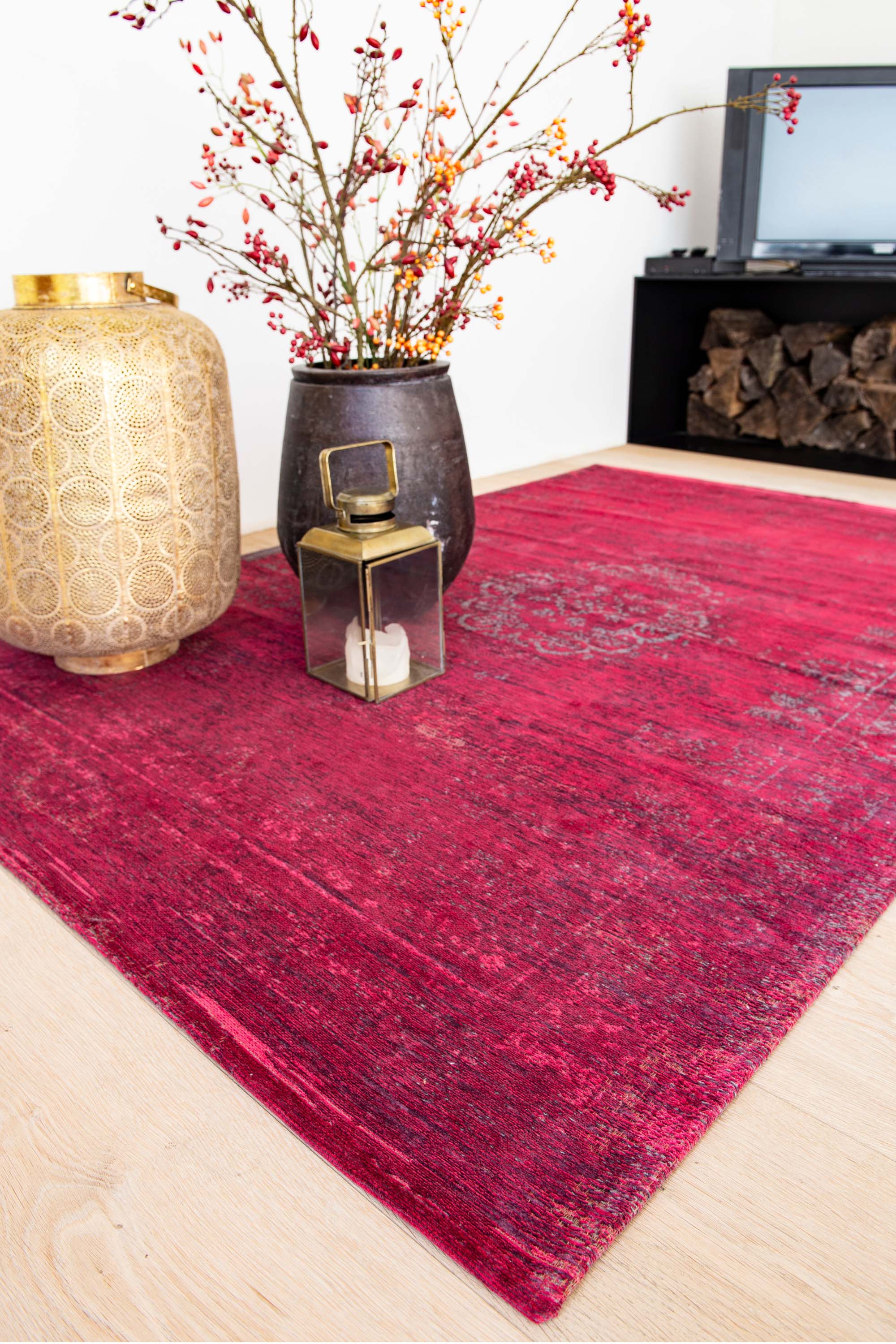 Red rug with faded persian design