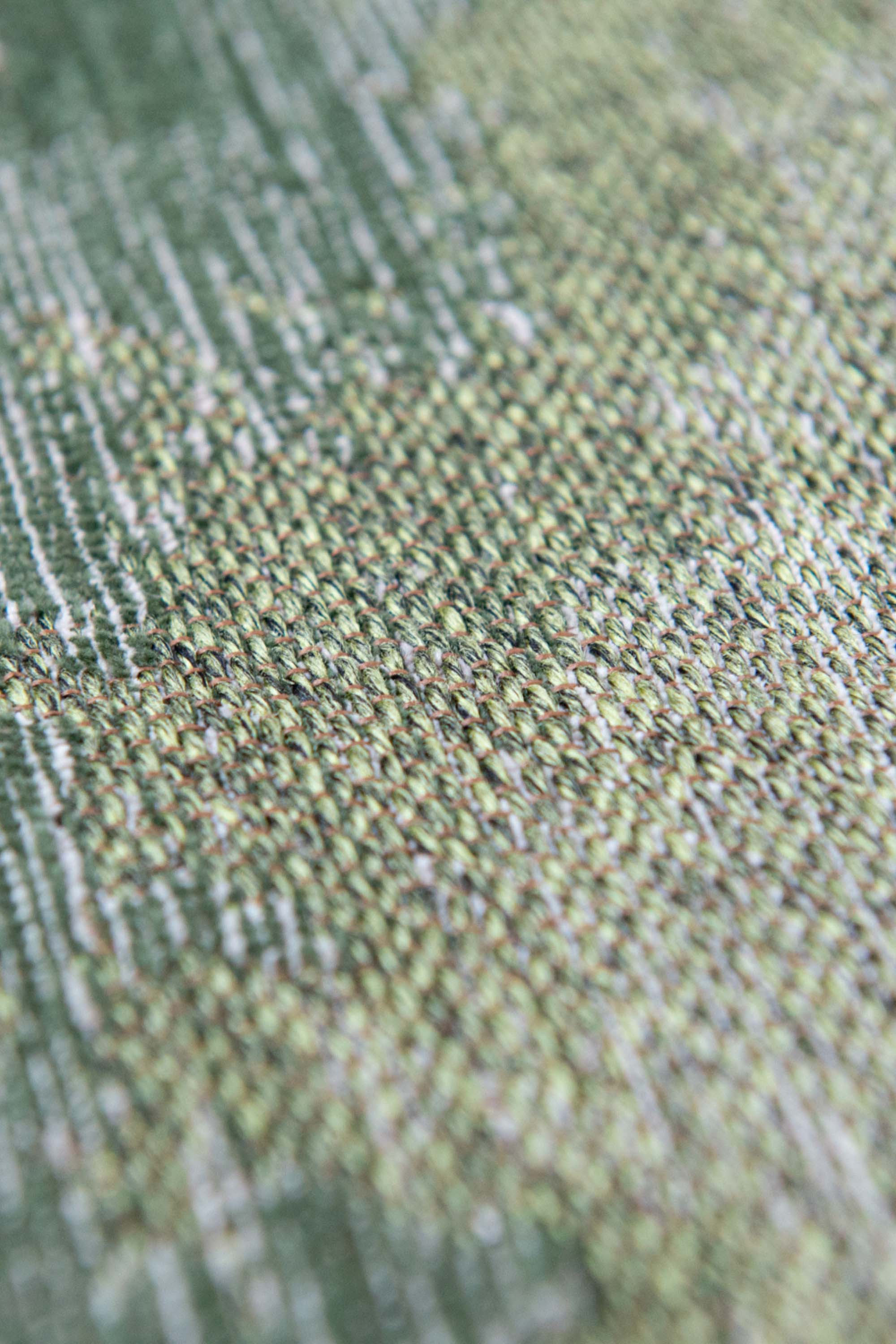 Modern rug with green abstract shoreline pattern