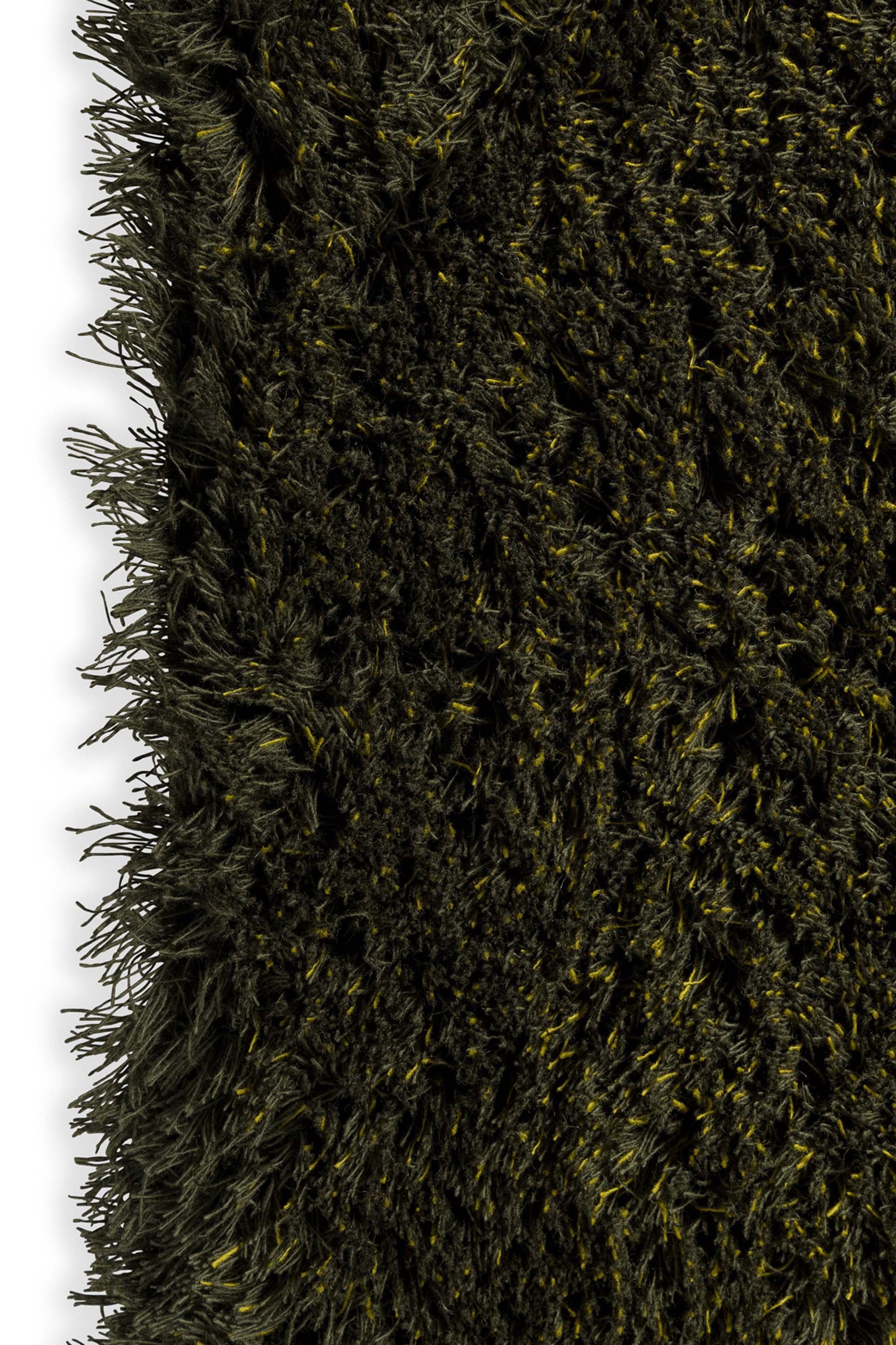 Plain green rug with shaggy pile
