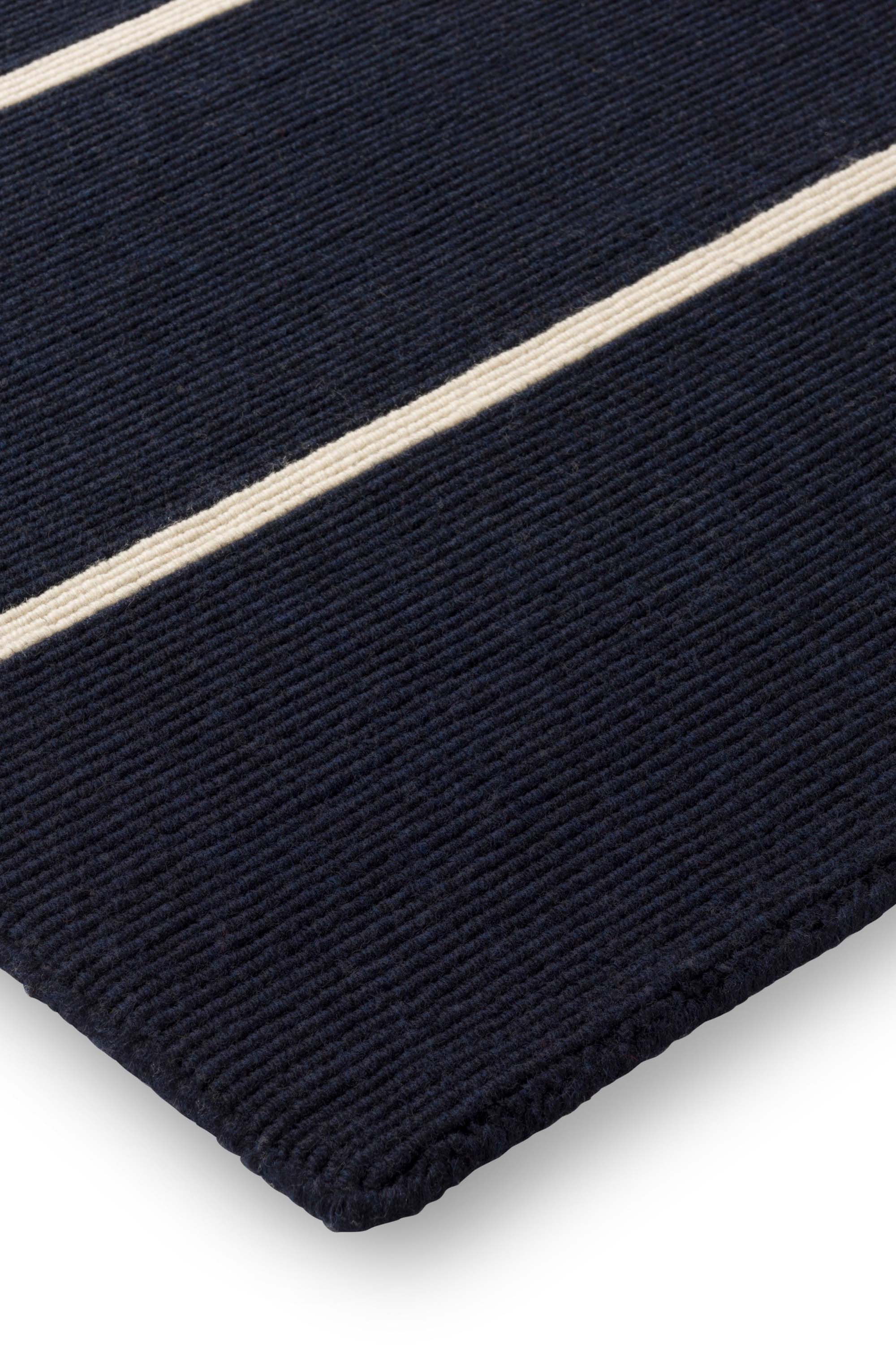Geometric rug with blue linear pattern