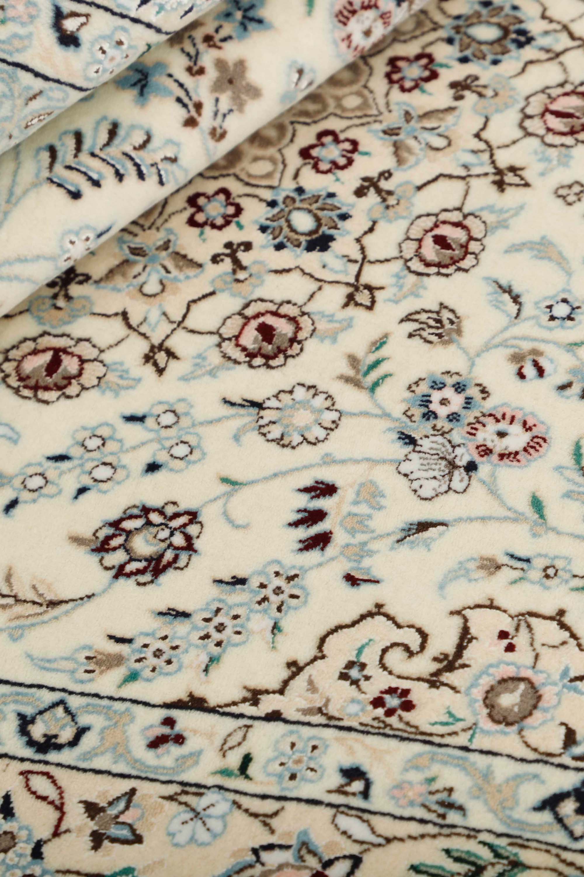 Cream Nain Persian rug with blue and red floral pattern