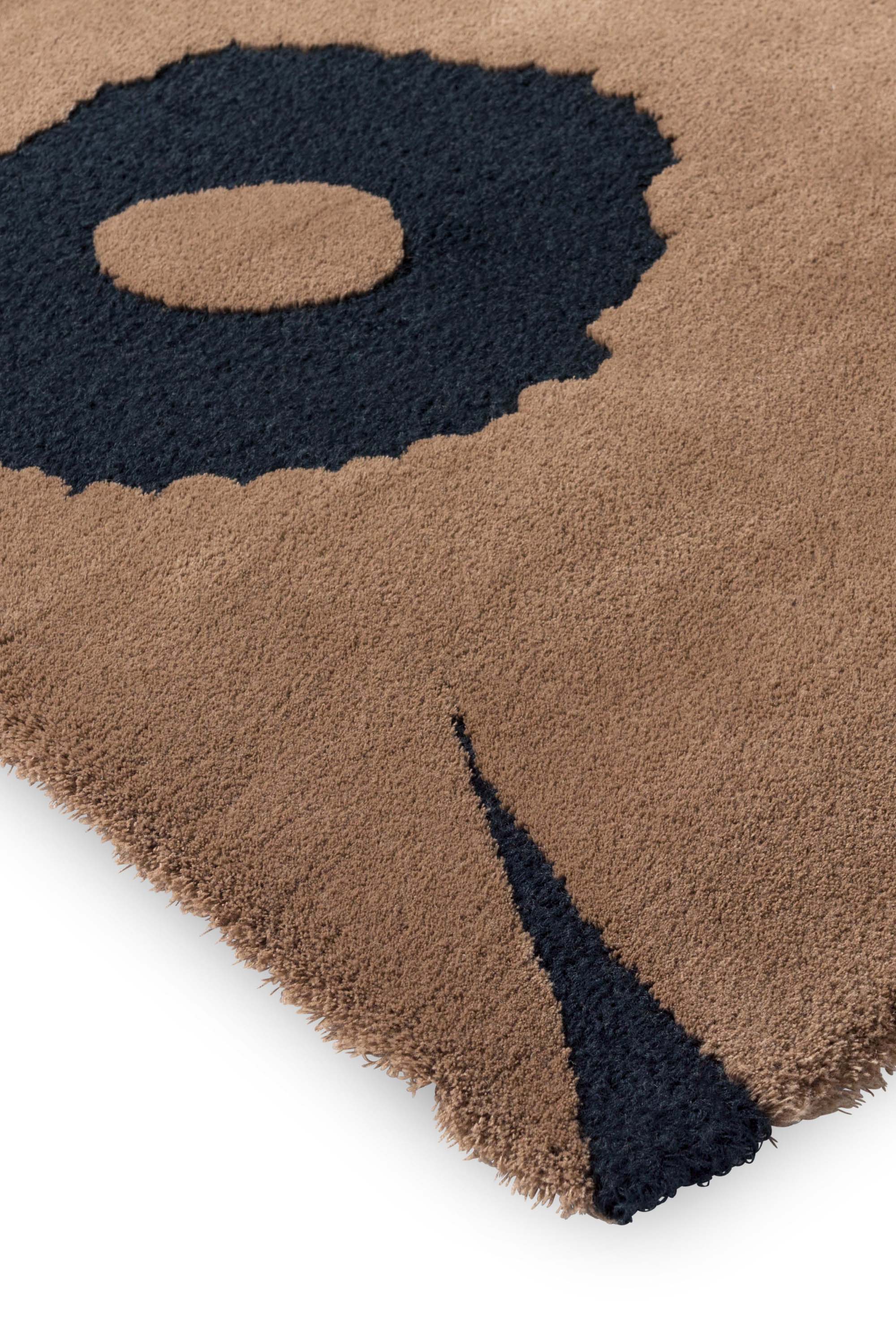 Brown patterned floral rug 