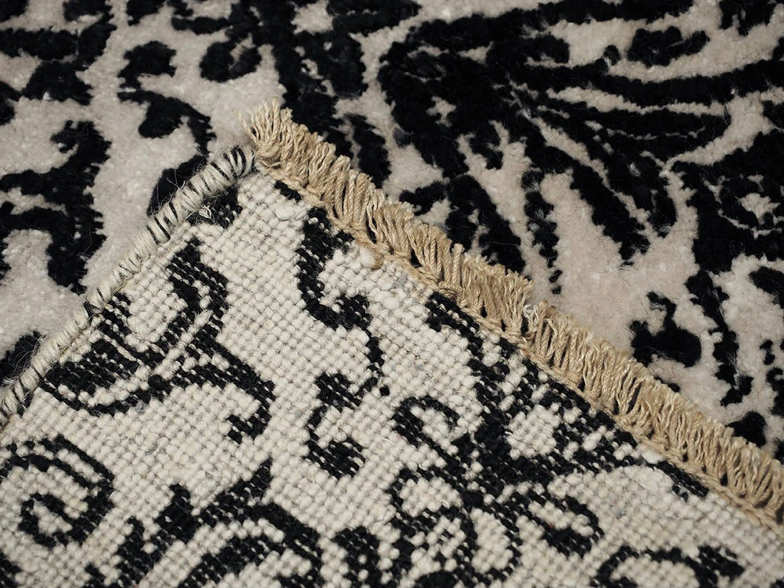 Authentic oriental rug with a damask pattern in brown