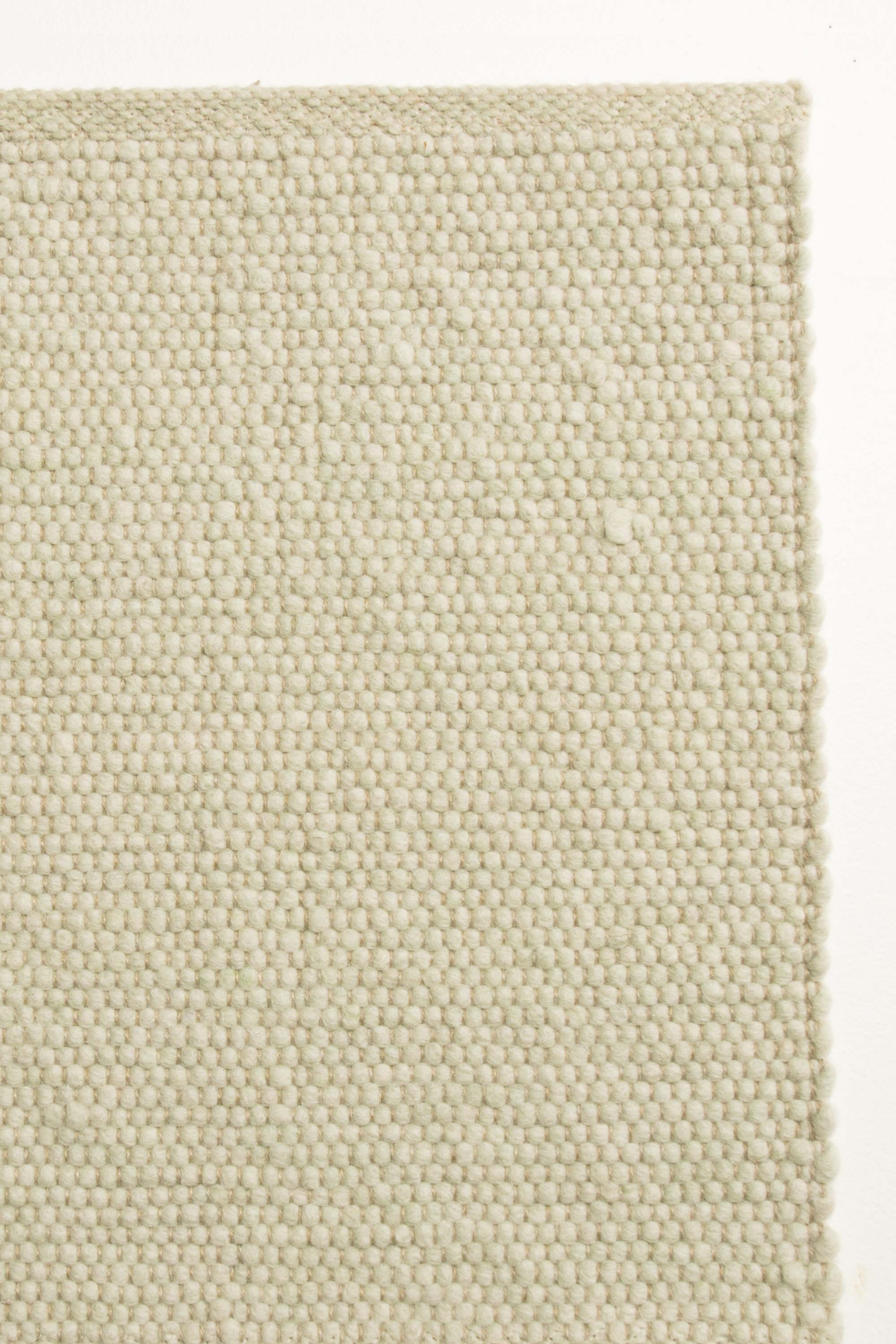 Green luxury plain handwoven rug