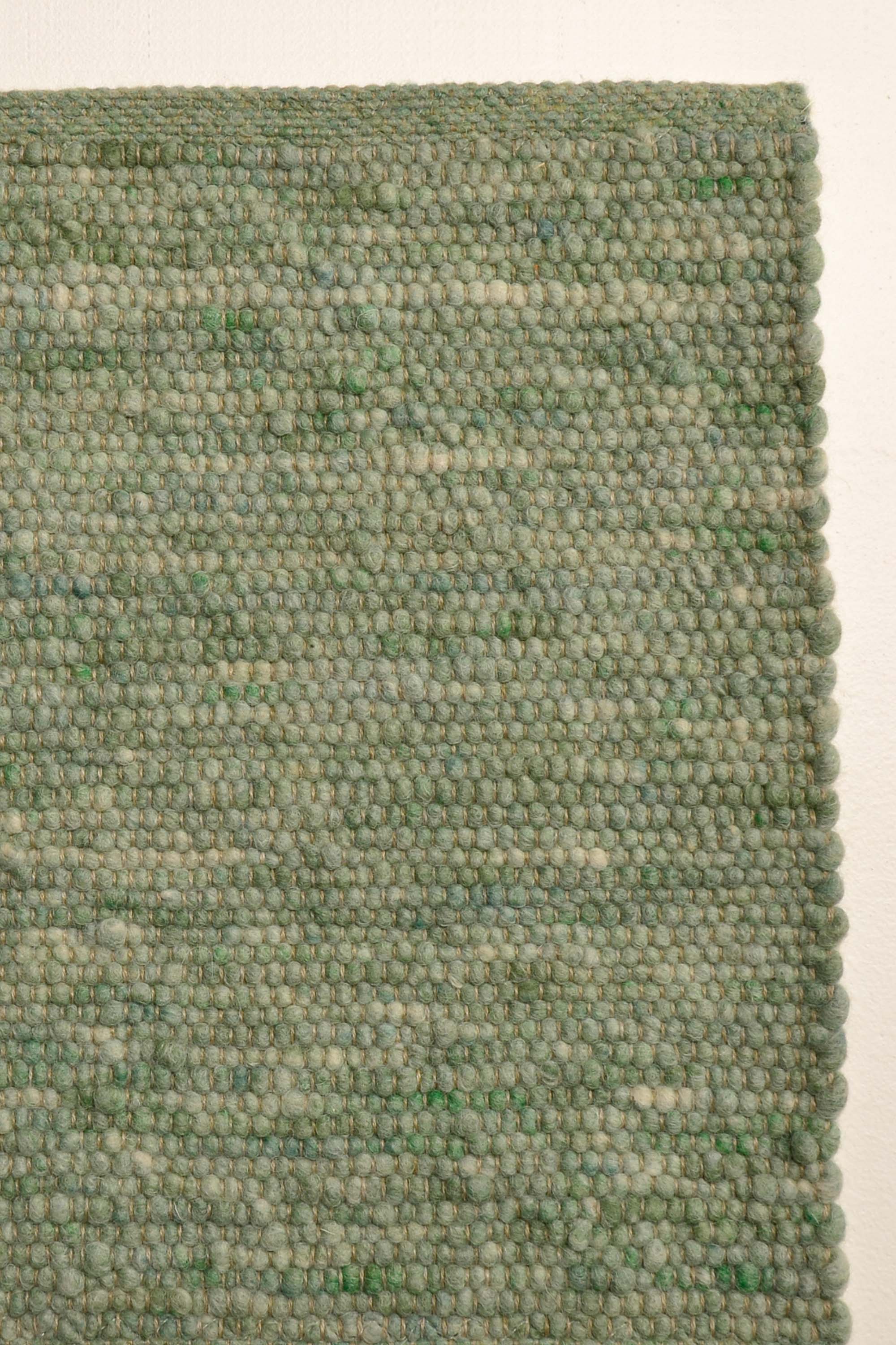 Green luxury plain handwoven rug