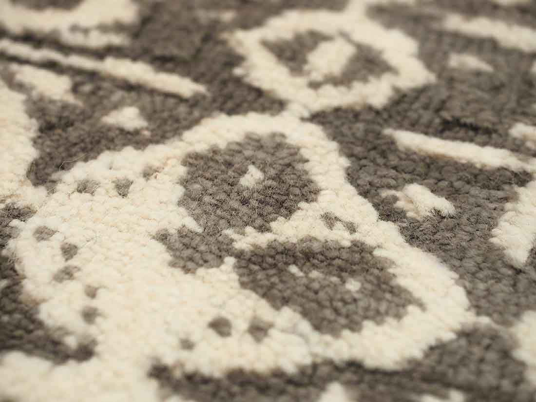 Authentic oriental rug with a damask pattern in beige