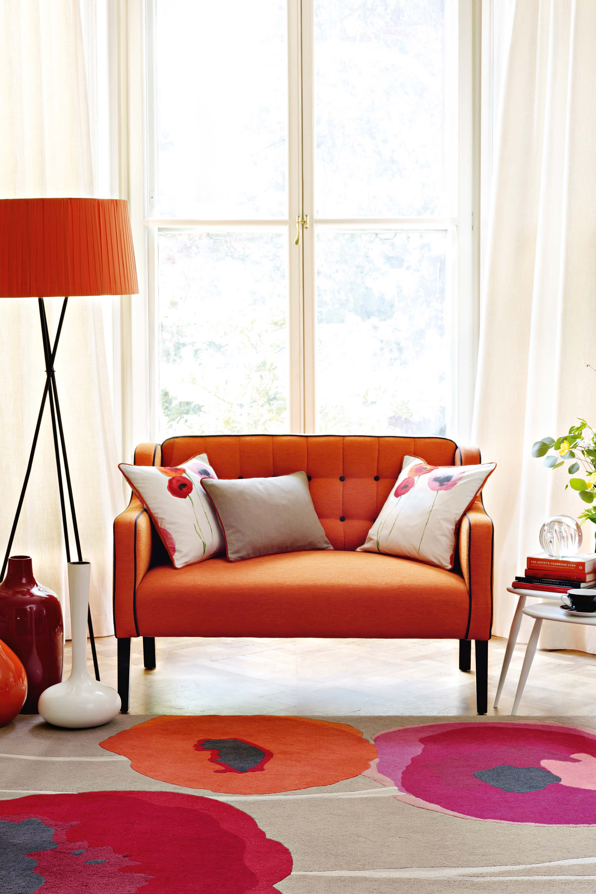 Brown floral rug with pink, red, and orange poppies