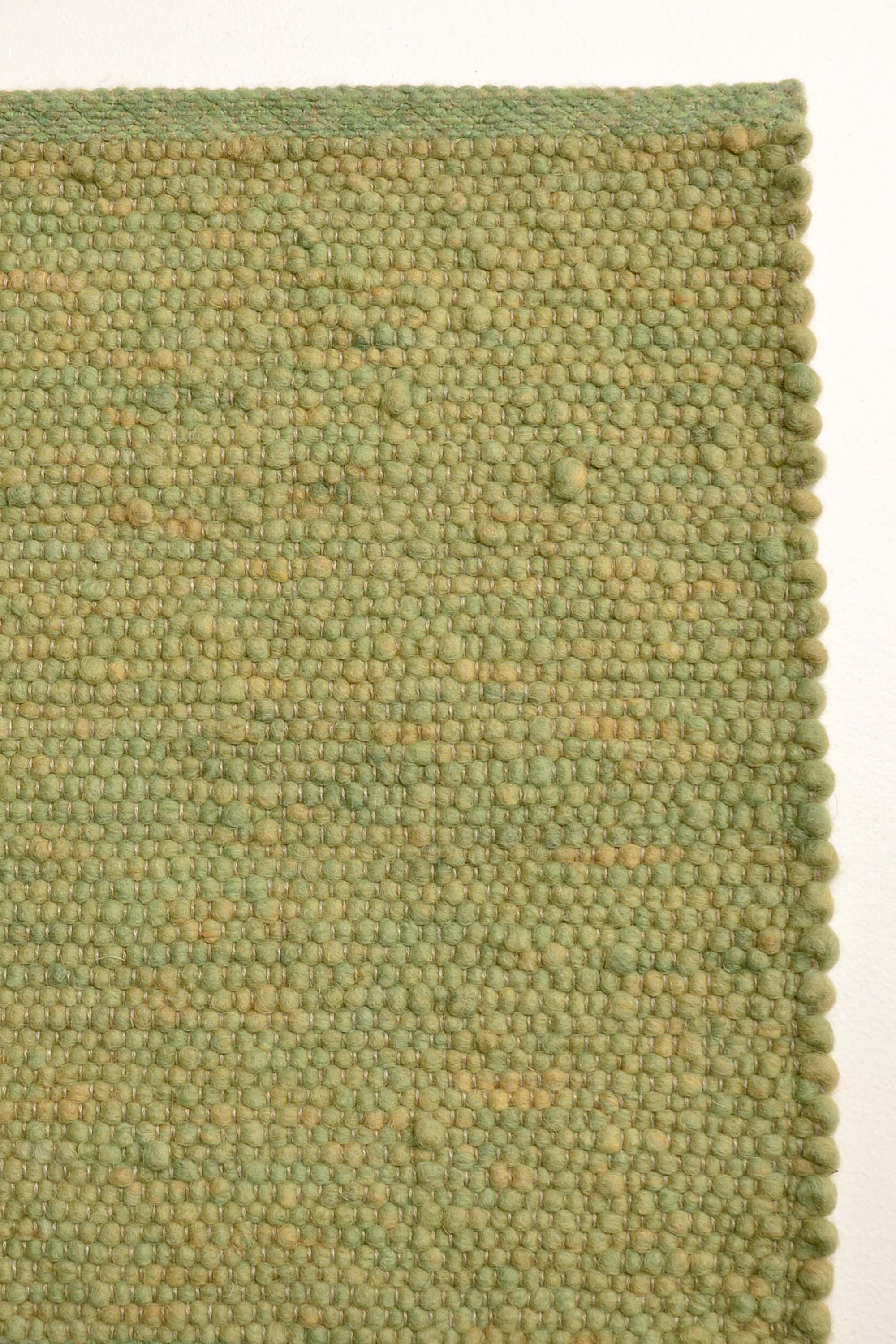 Green luxury plain handwoven rug
