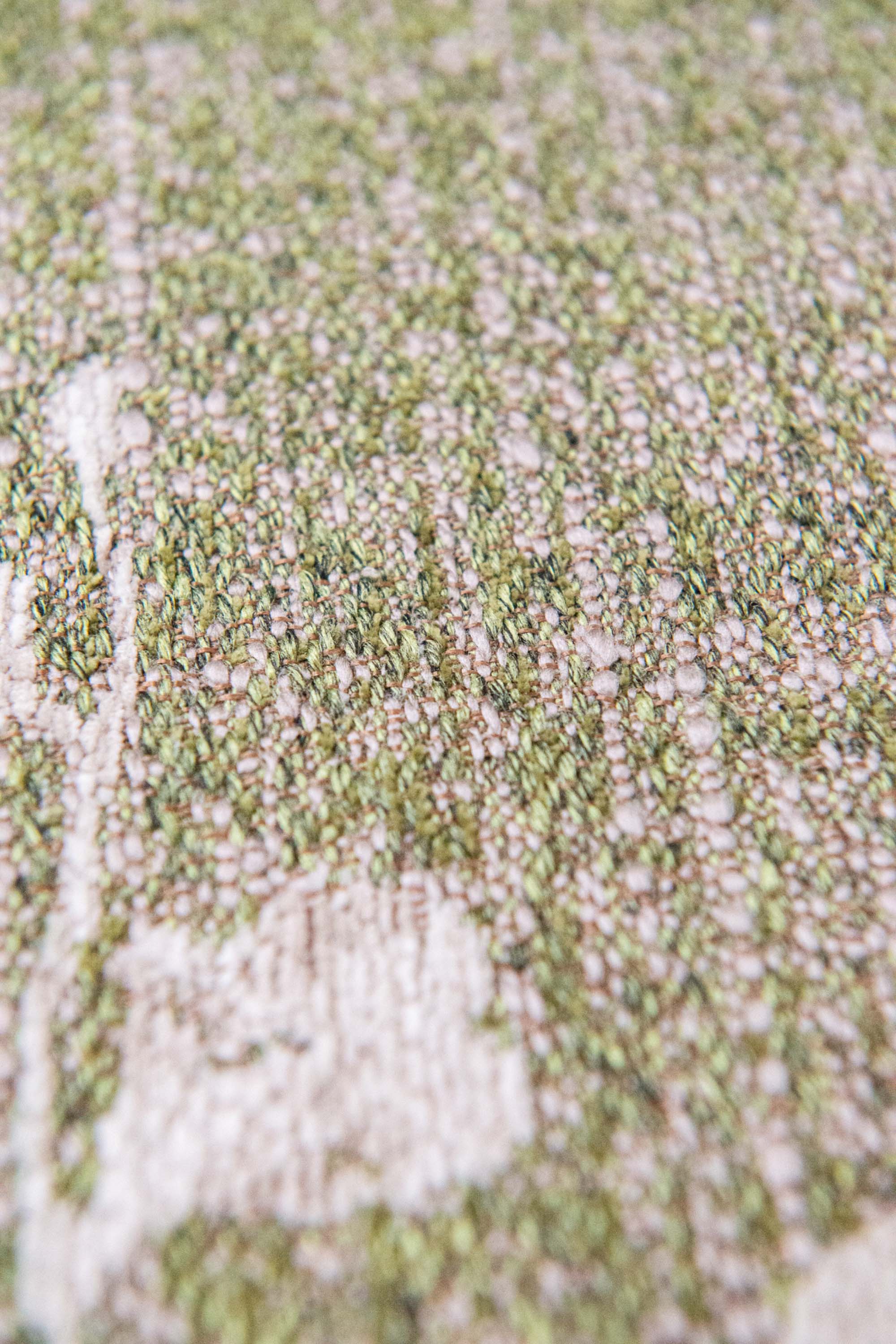 Modern abstract rug with subtle green floral pattern