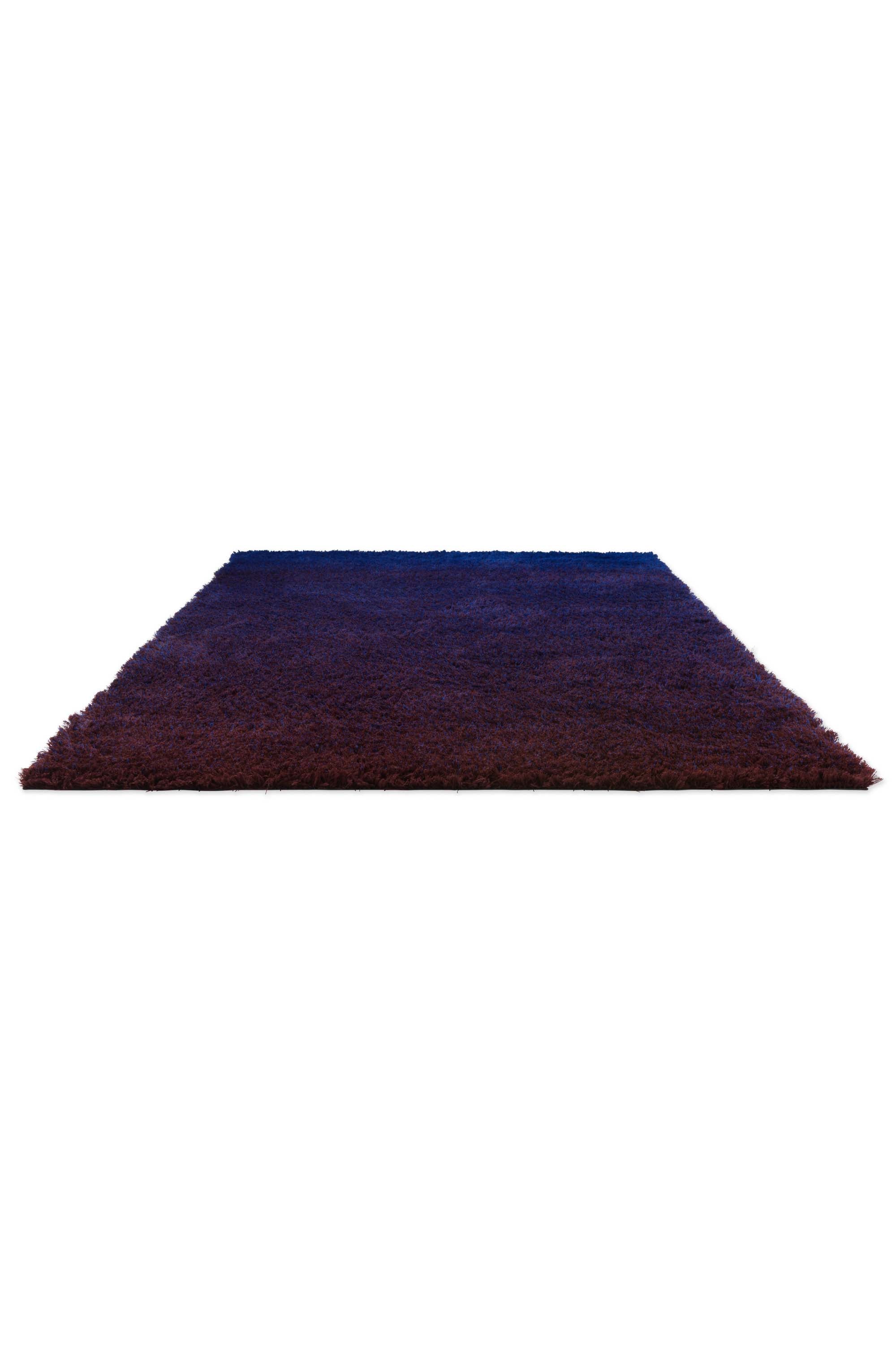 Plain blue rug with shaggy pile