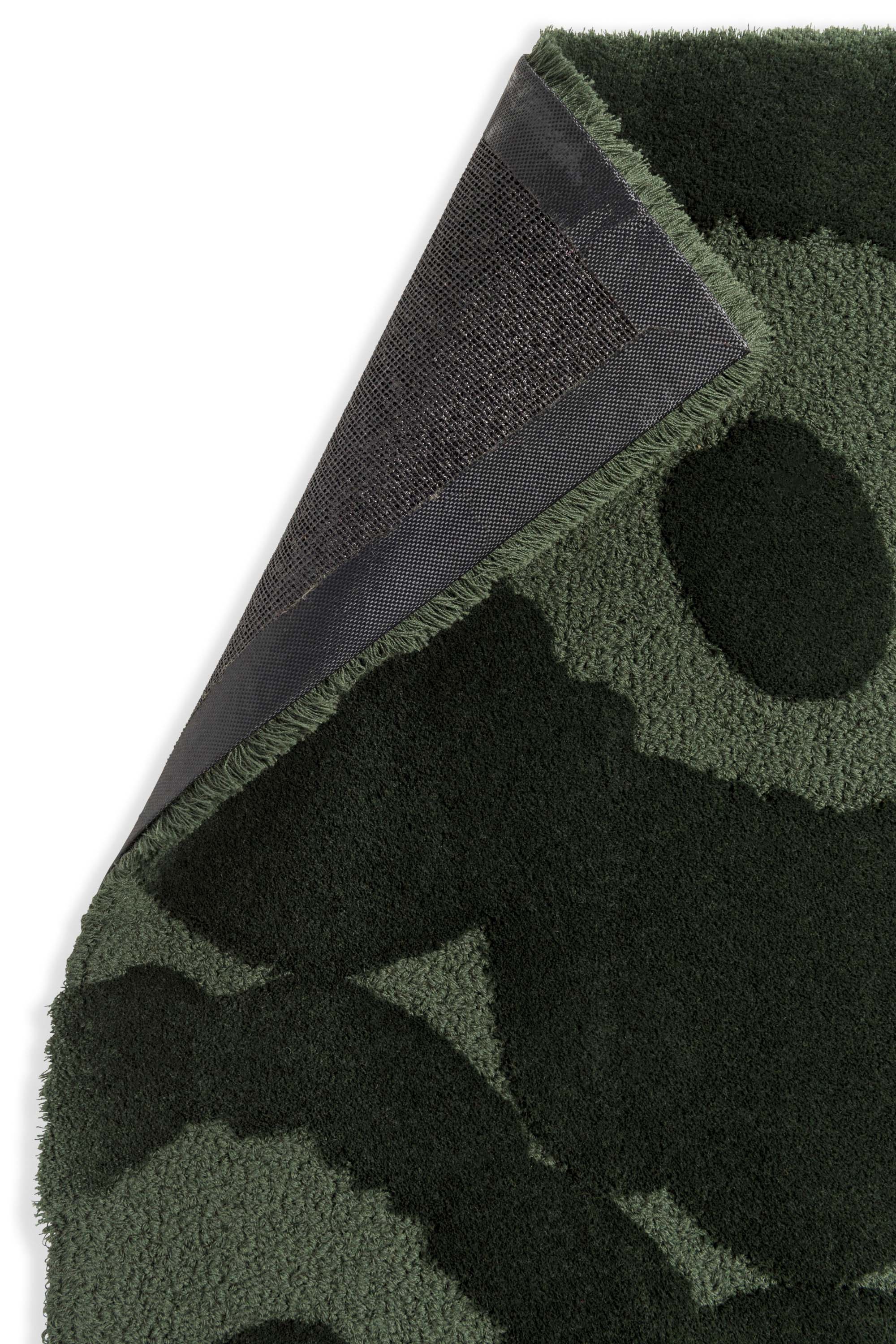 Dark green patterned floral rug