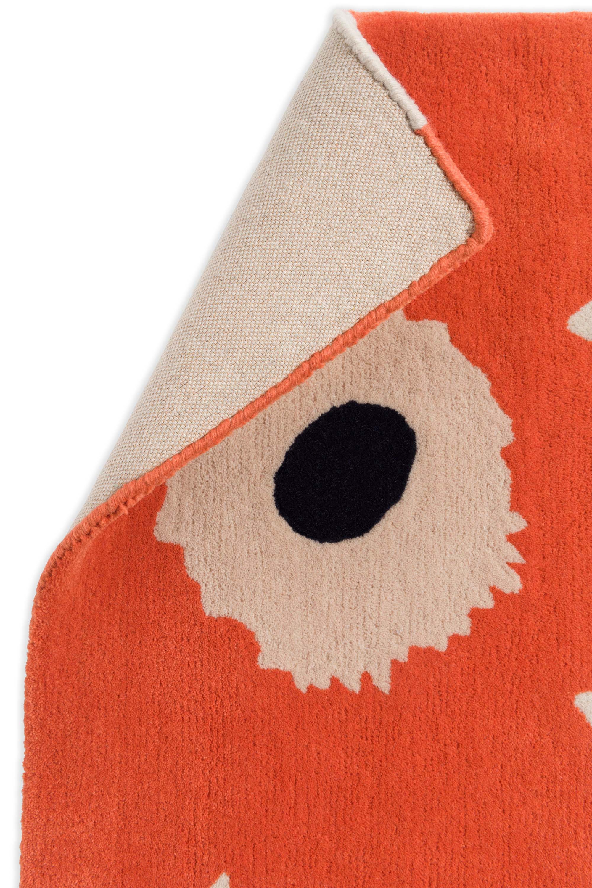 Orange patterned floral rug