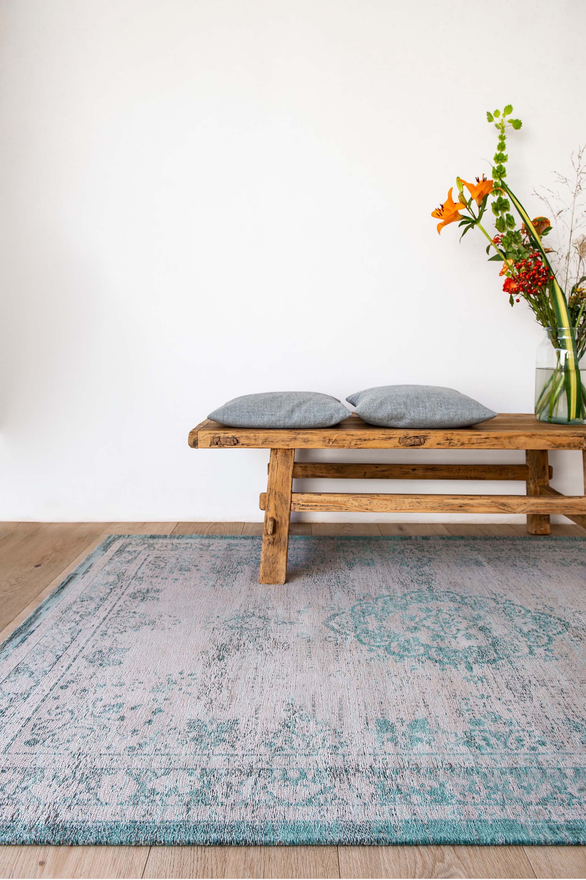 Grey flatweave rug with faded green persian design